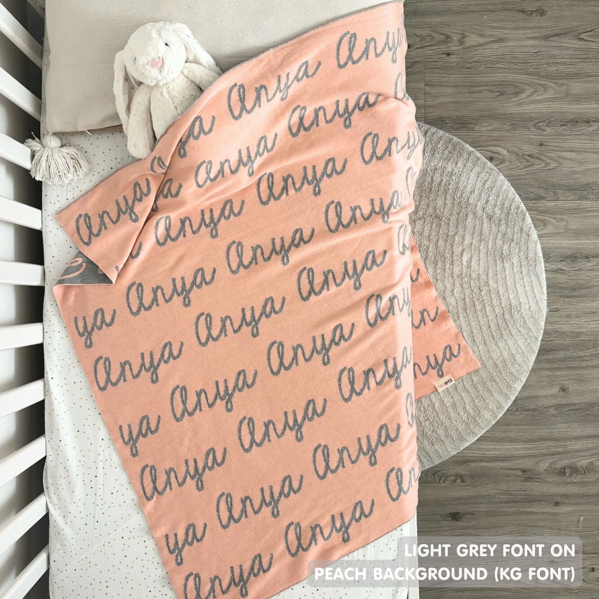TinyBitz Custom Blanket knitted from cotton with baby's name on peach background, best gift to welcome a newborn baby.