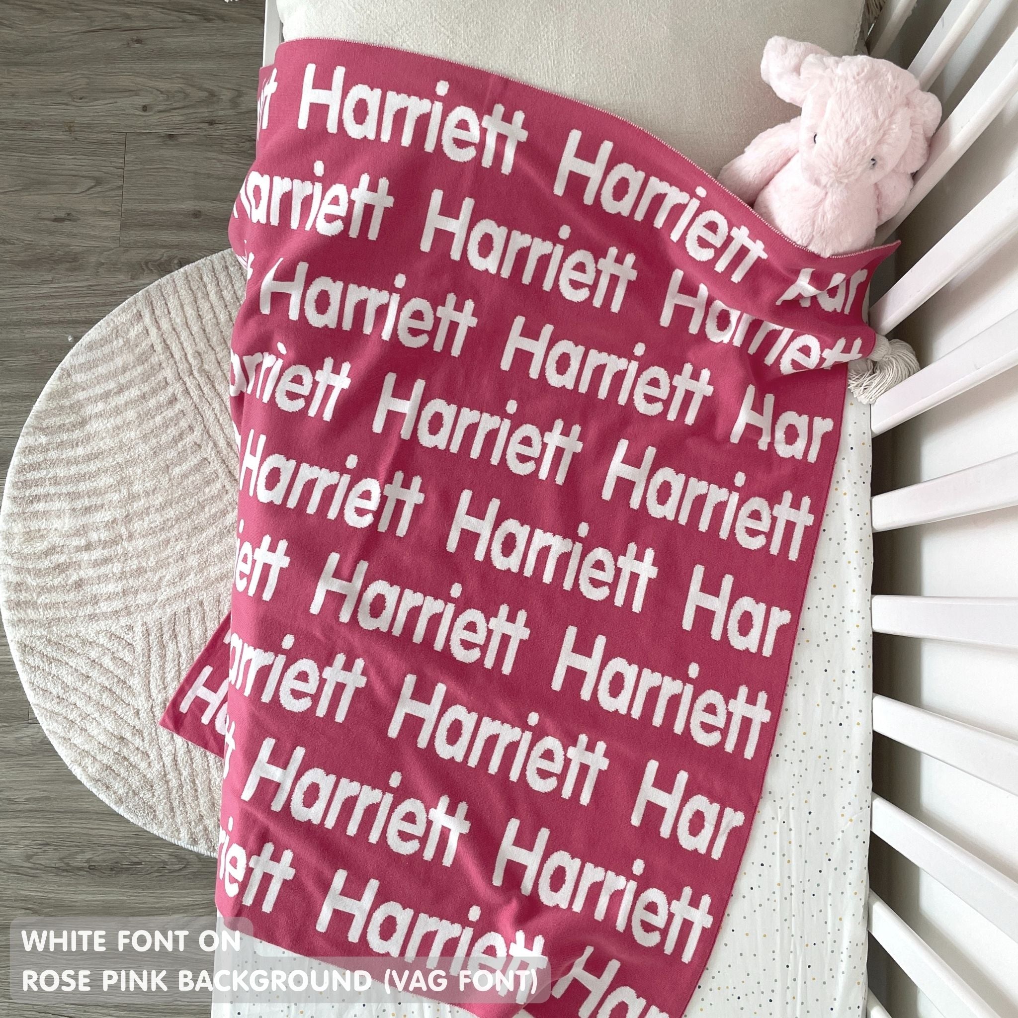 TinyBitz knitted baby girls blanket in rose pink background and white, personalized with your baby’s name.