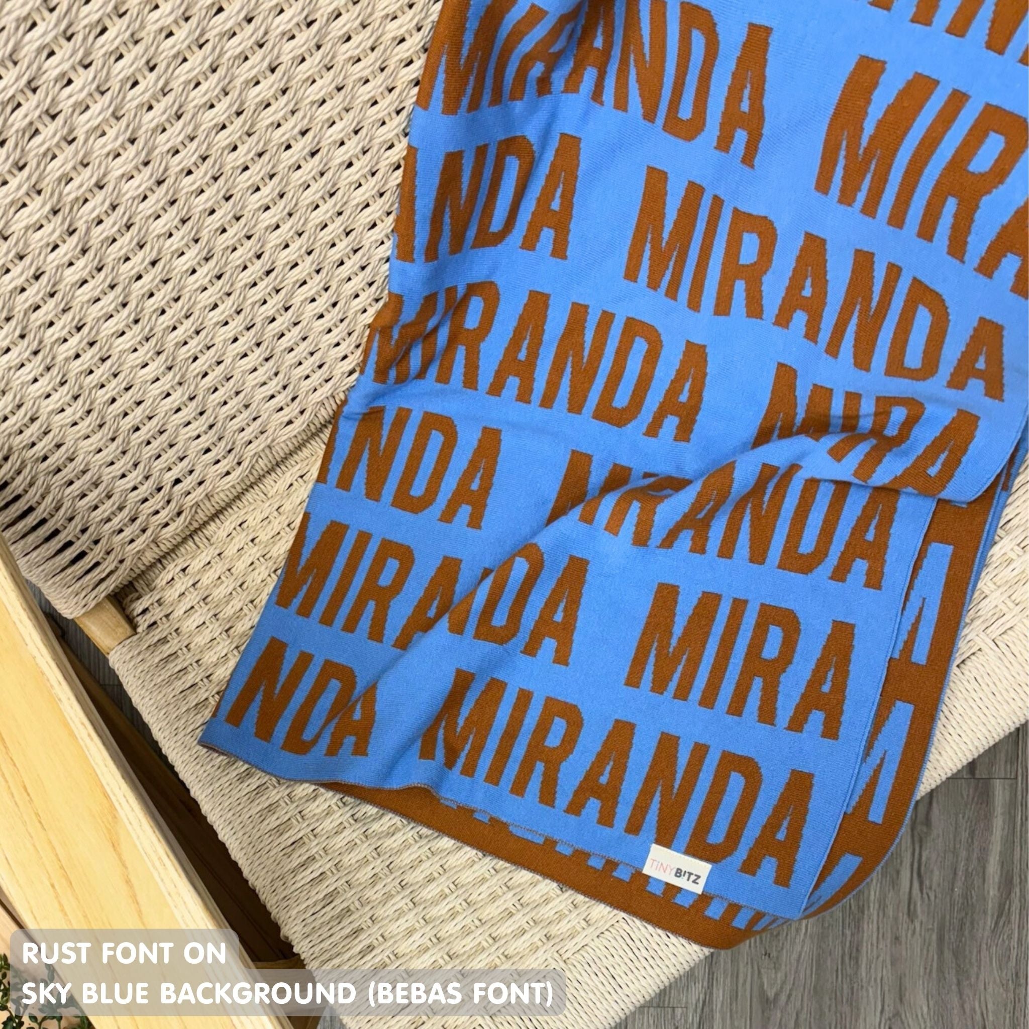 Personalised blanket for adult knitted from cotton in sky blue and rust, custom made by TinyBitz.