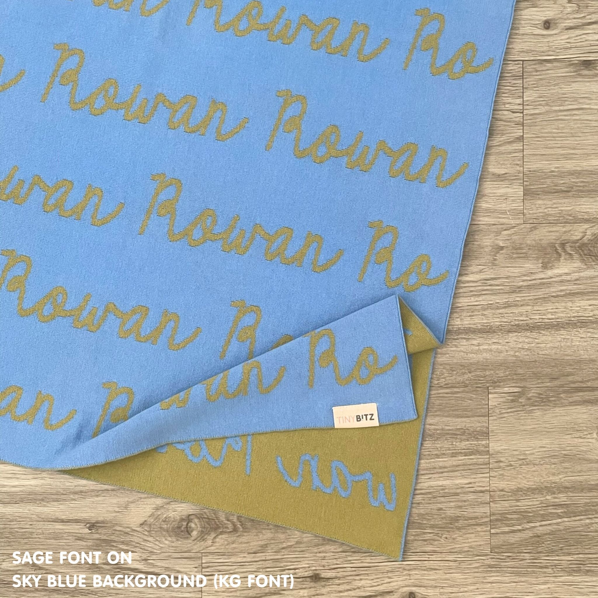 Personalised blanket for adult knitted from cotton in sky blue and sage, custom made by TinyBitz.