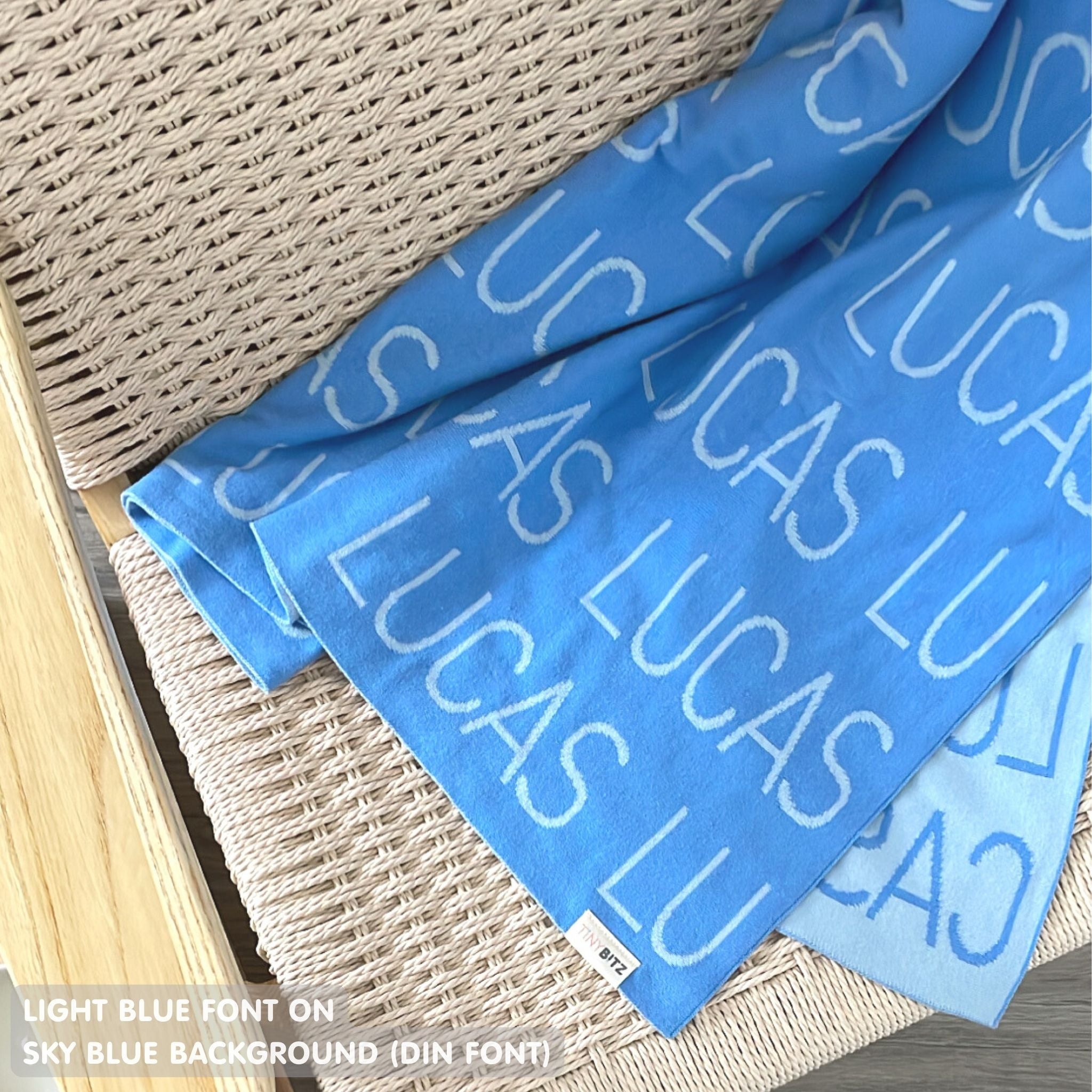 TinyBitz Custom Blanket knitted from cotton with baby's name on sky blue background, best gift to welcome a newborn baby.