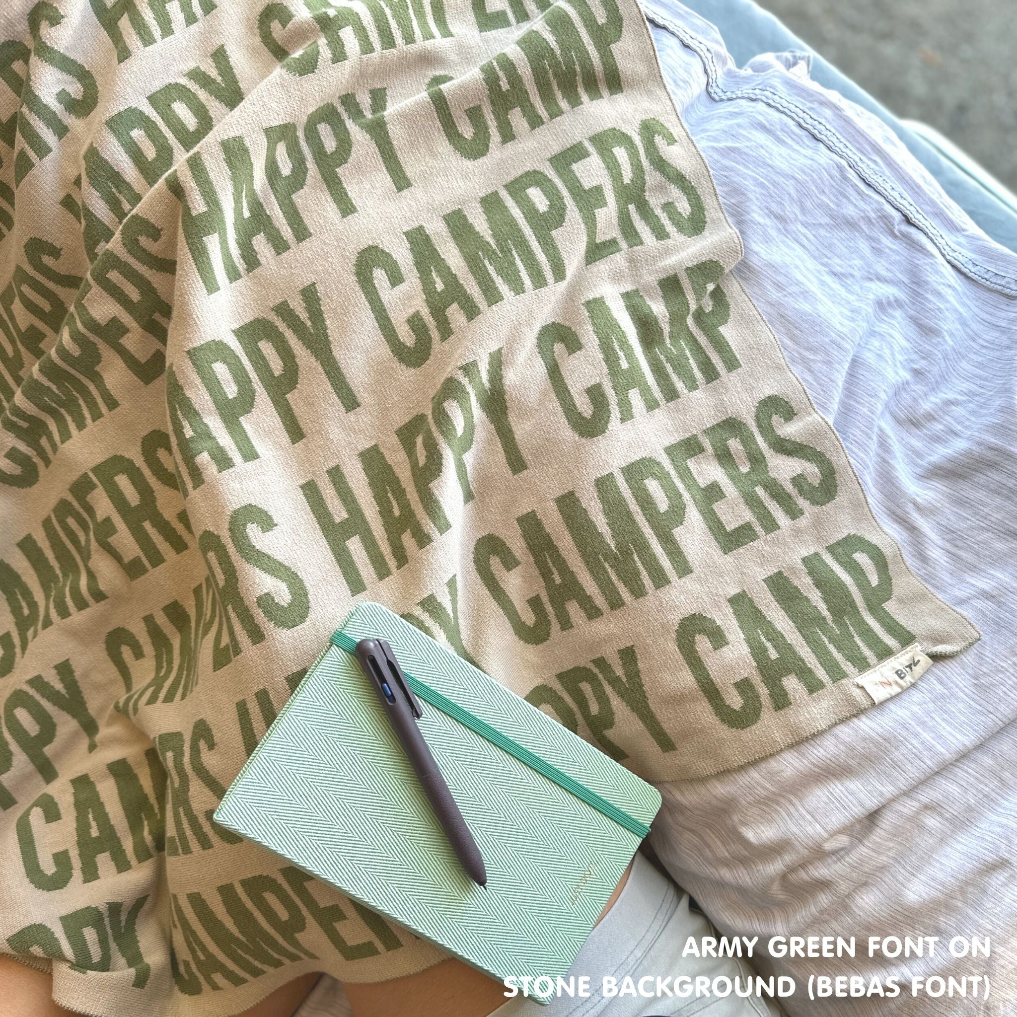 TinyBitz personalized knitted cotton blanket in stone and army green, perfect for outdoor camping.