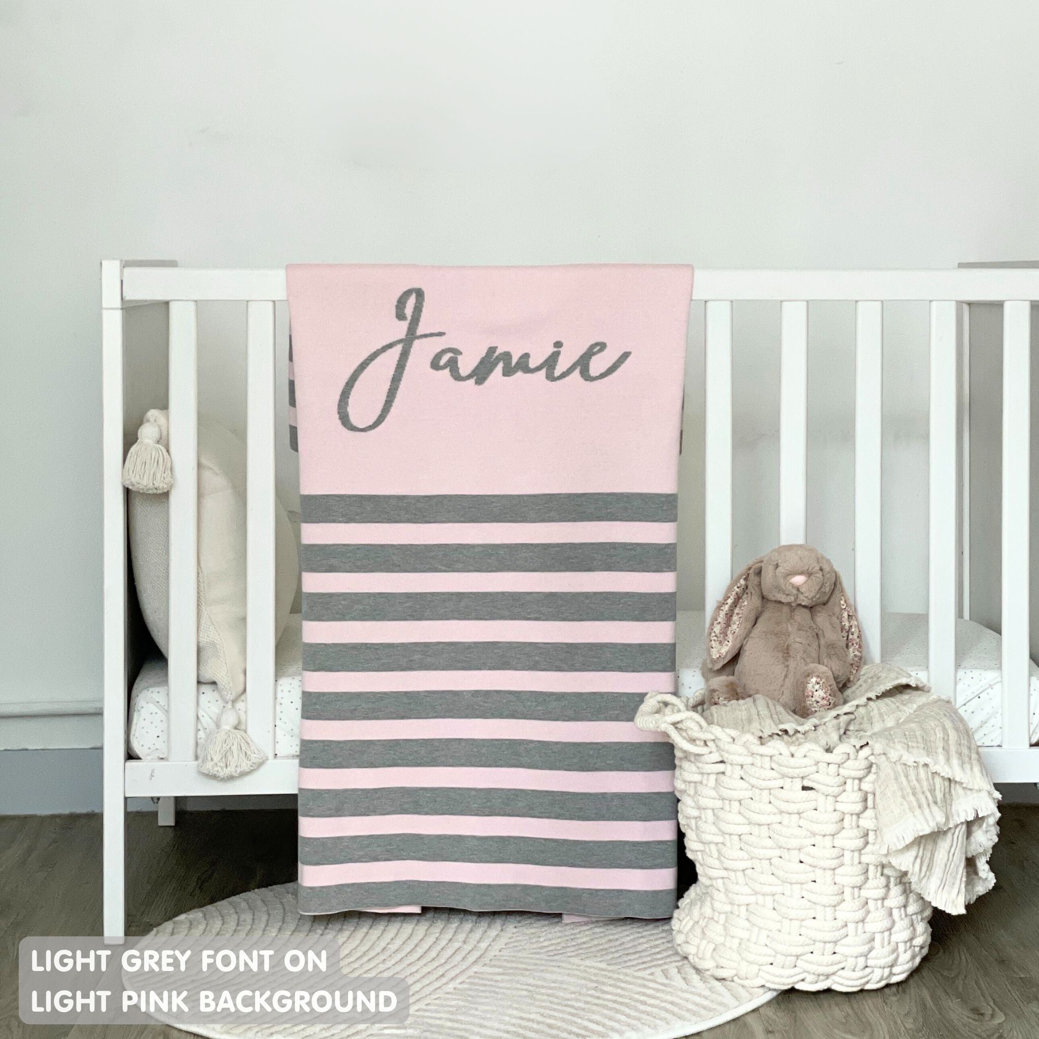 TinyBitz personalized kids knitted name blanket in light pink and light grey with a stripes pattern, perfect gift for birthdays!
