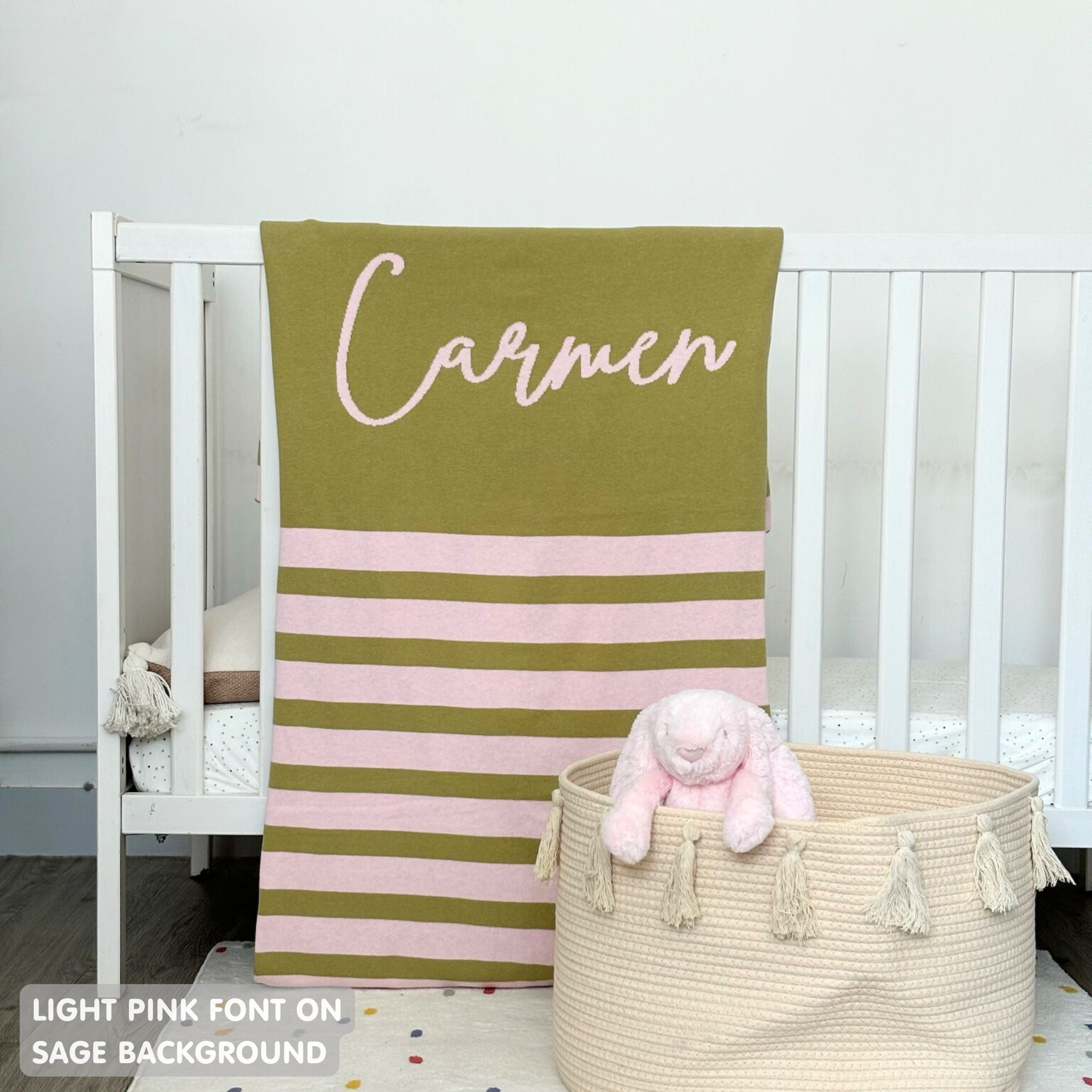 Baby blanket knitted from cotton personalized with baby's name in sage and light pink with a stripes pattern, made by TinyBitz.