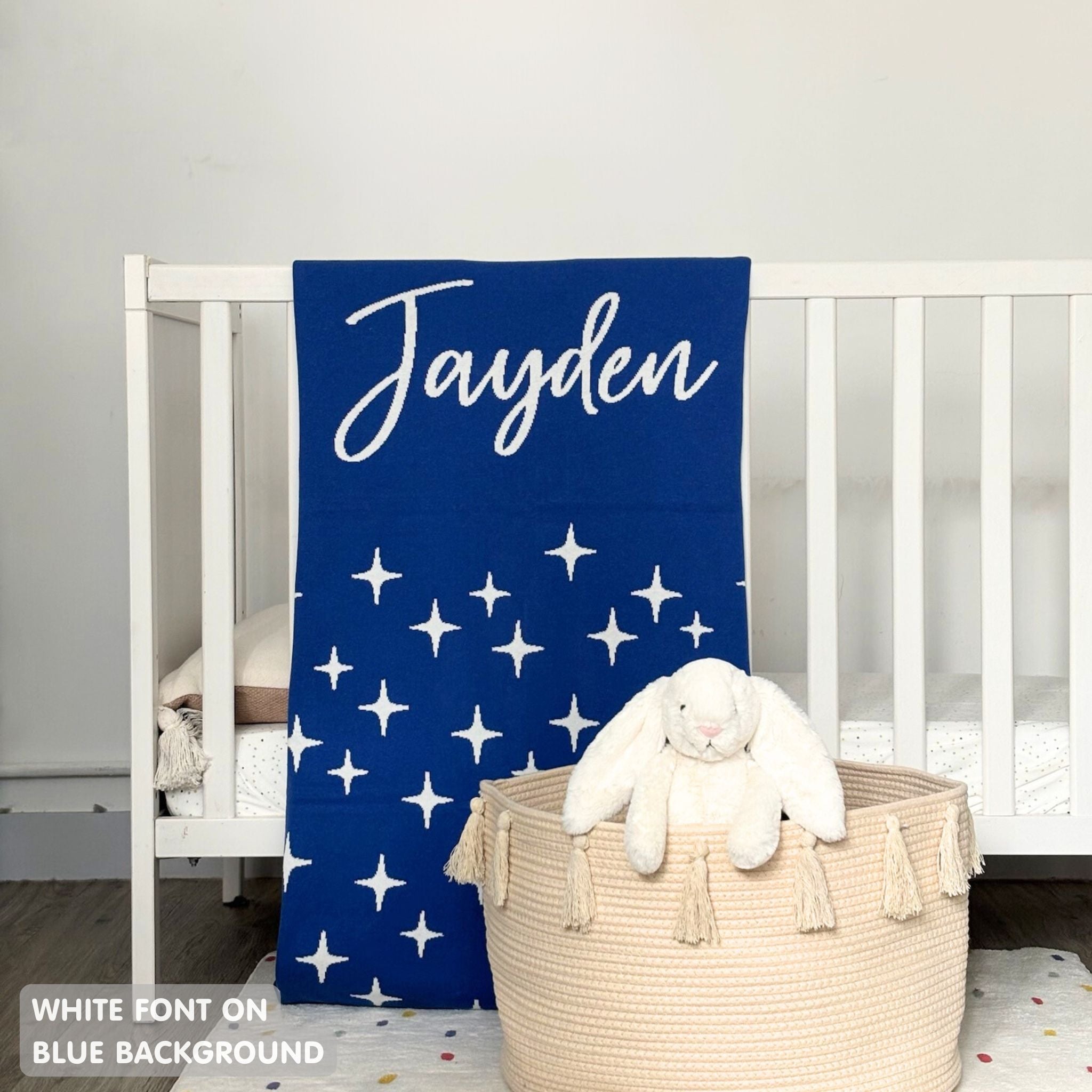 TinyBitz personalized kids knitted name blanket in blue background with a twinkles pattern, perfect gift for birthdays!