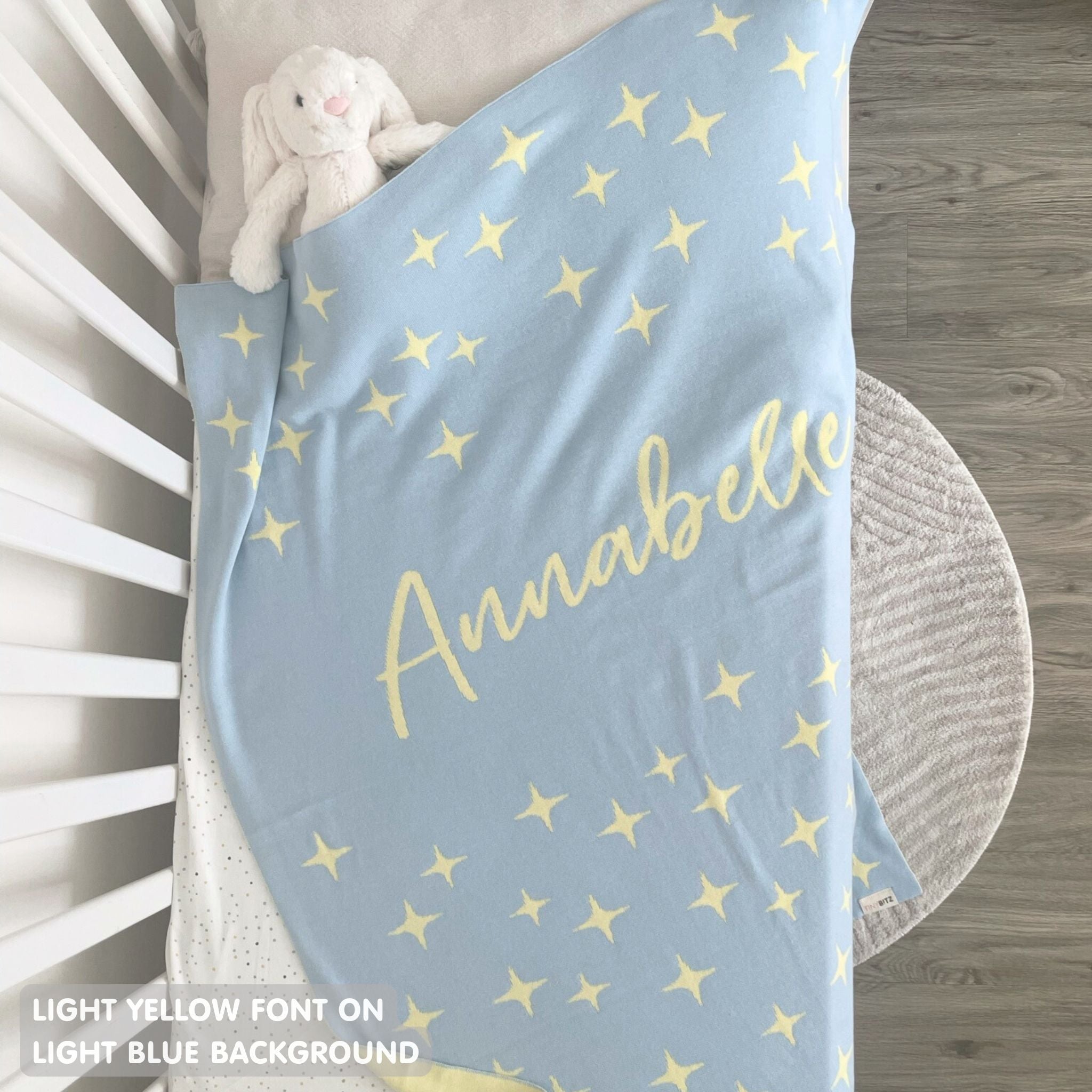 TinyBitz personalized kids knitted name blanket in light blue with a twinkles pattern, perfect gift for birthdays!