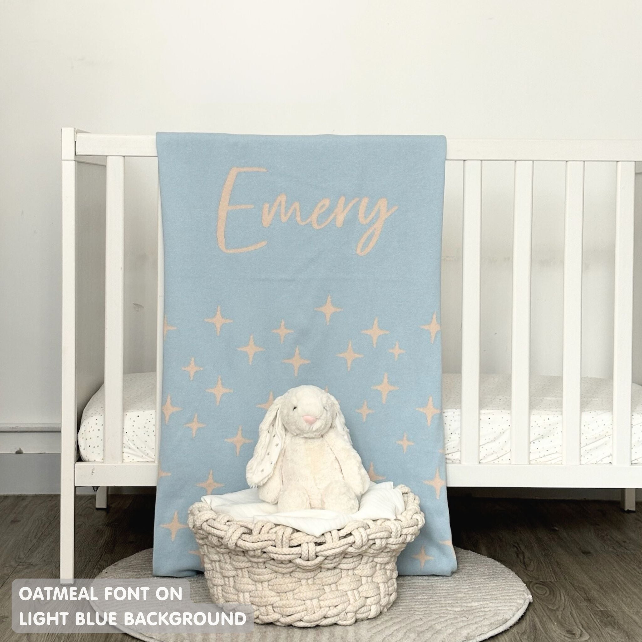 TinyBitz knitted name blanket in light blue and oatmeal with a twinkles pattern, a lovely touch to decorate your baby's room!