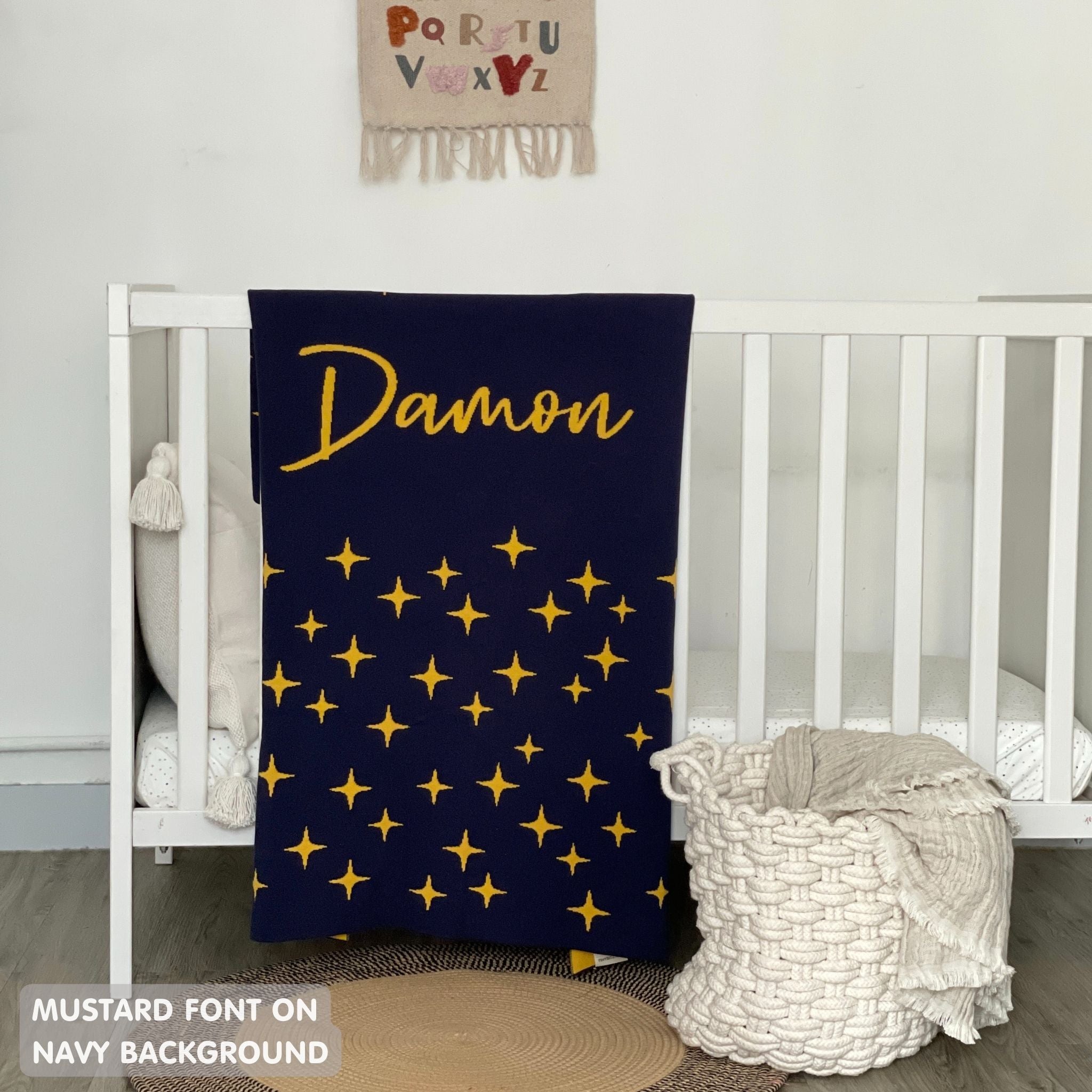 TinyBitz personalized baby name blanket, knitted in navy and mustard with a twinkles pattern, perfect baby shower gift!