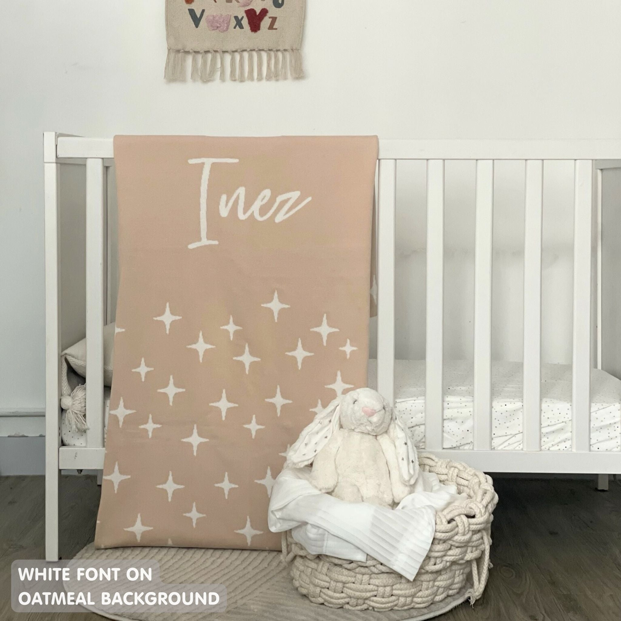 TinyBitz knitted name blanket in oatmeal and white with a twinkles pattern, a lovely touch to decorate your baby's room!