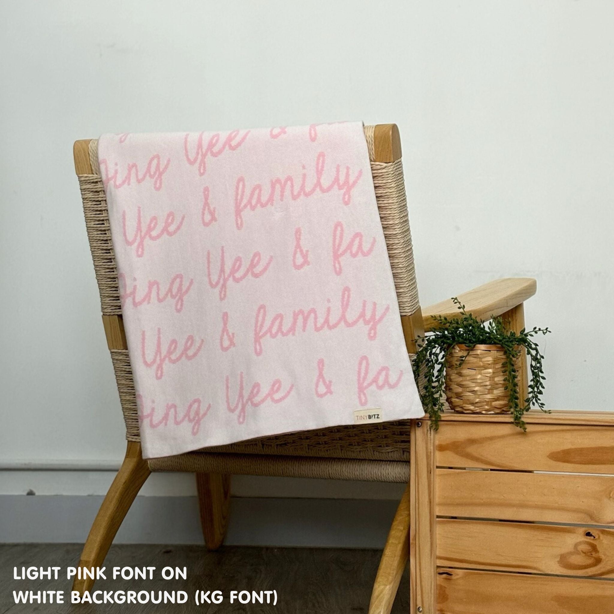 Personalised family blanket knitted in white and light pink, custom made by TinyBitz.