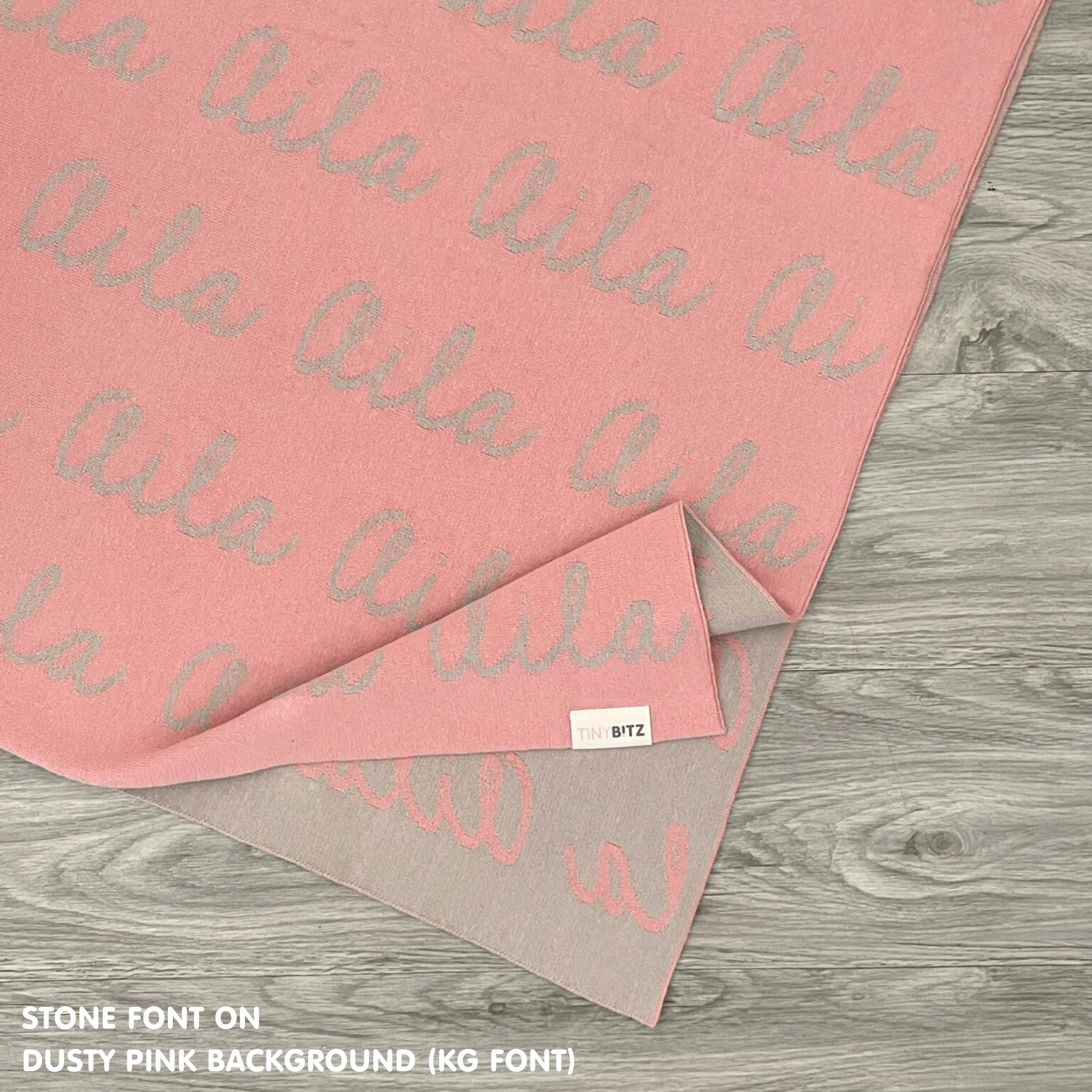 Cotton Kids Blanket with name knitted in dusty pink and stone, made by TinyBitz.