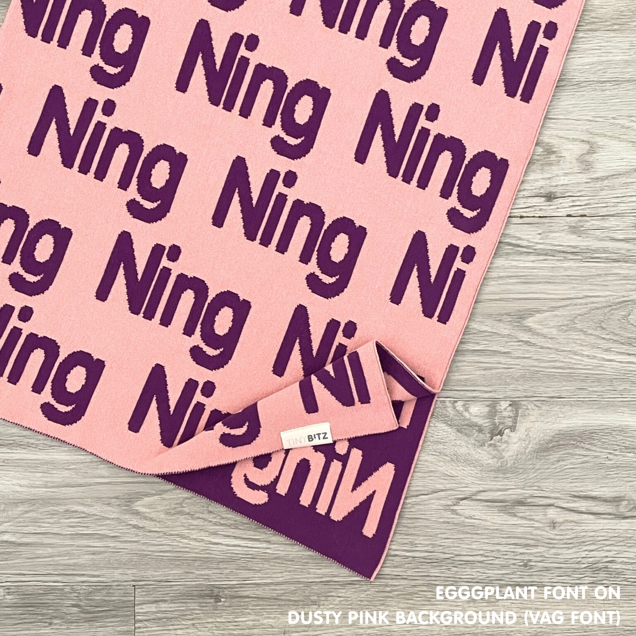 Cotton Kids Blanket with name knitted in dusty pink and eggplant, made by TinyBitz.