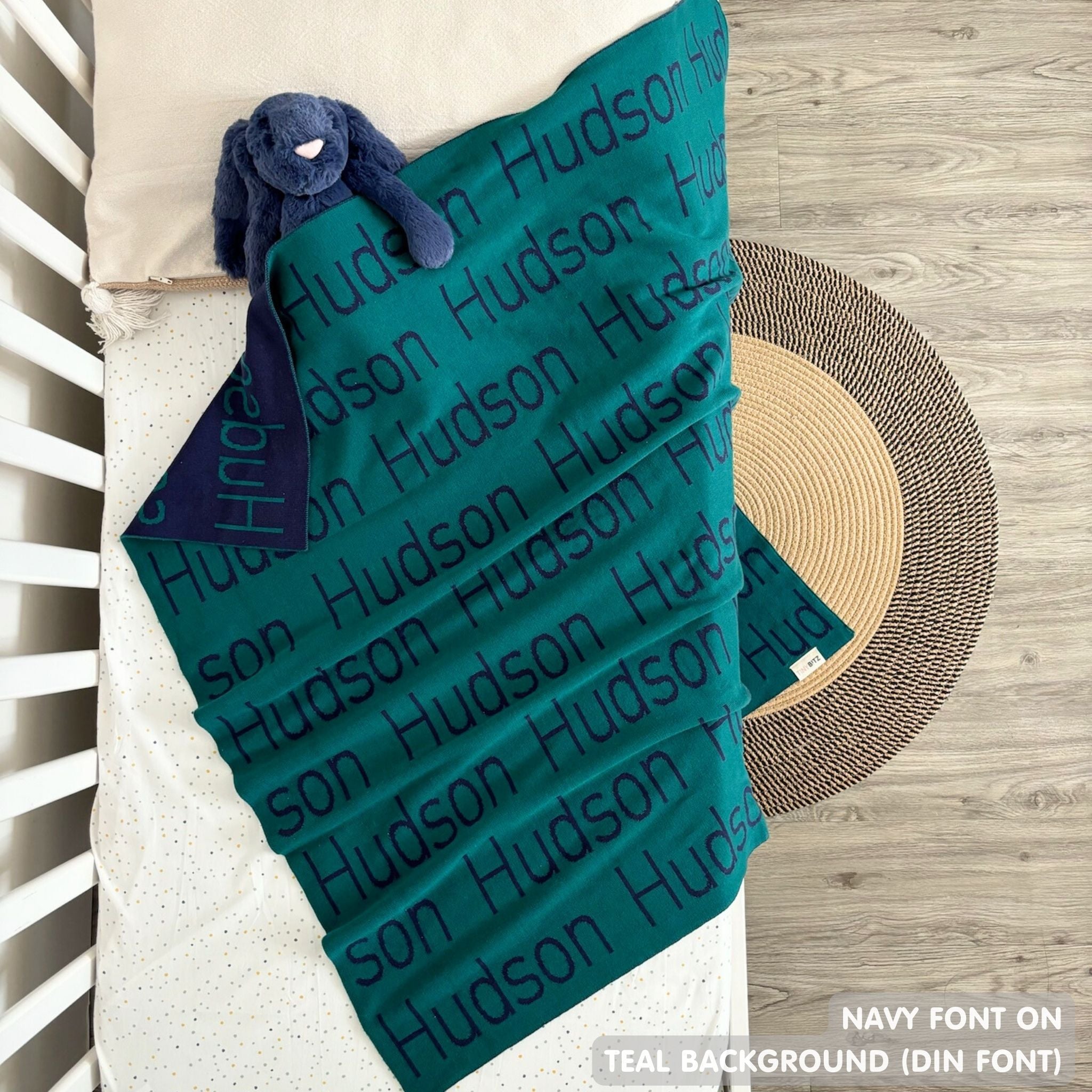 TinyBitz Kids Blanket in teal and navy, personalized with child's name and made from 100% cotton.