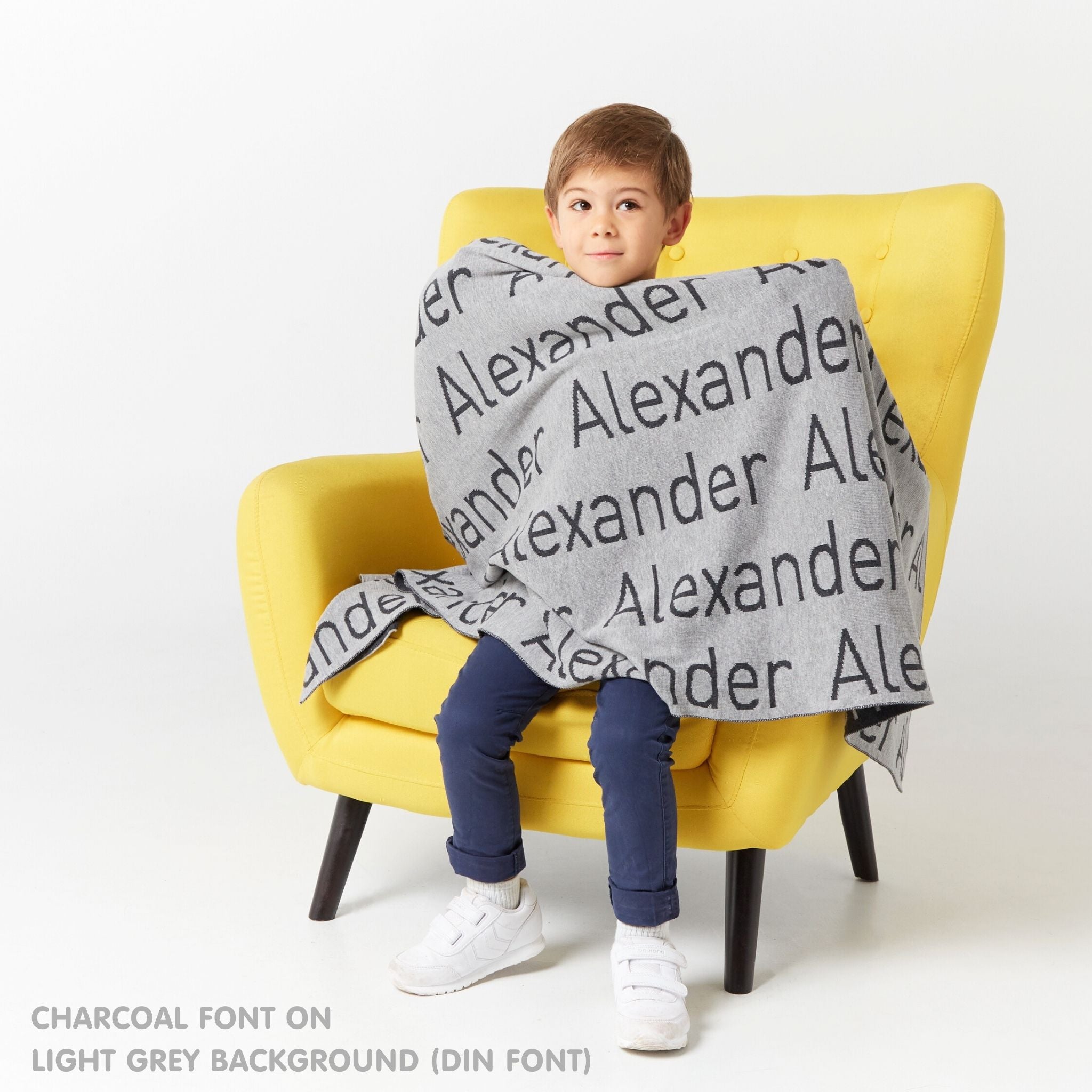 TinyBitz Personalized kids knitted name blanket in light grey and charcoal, perfect as a birthday gifts for kids!