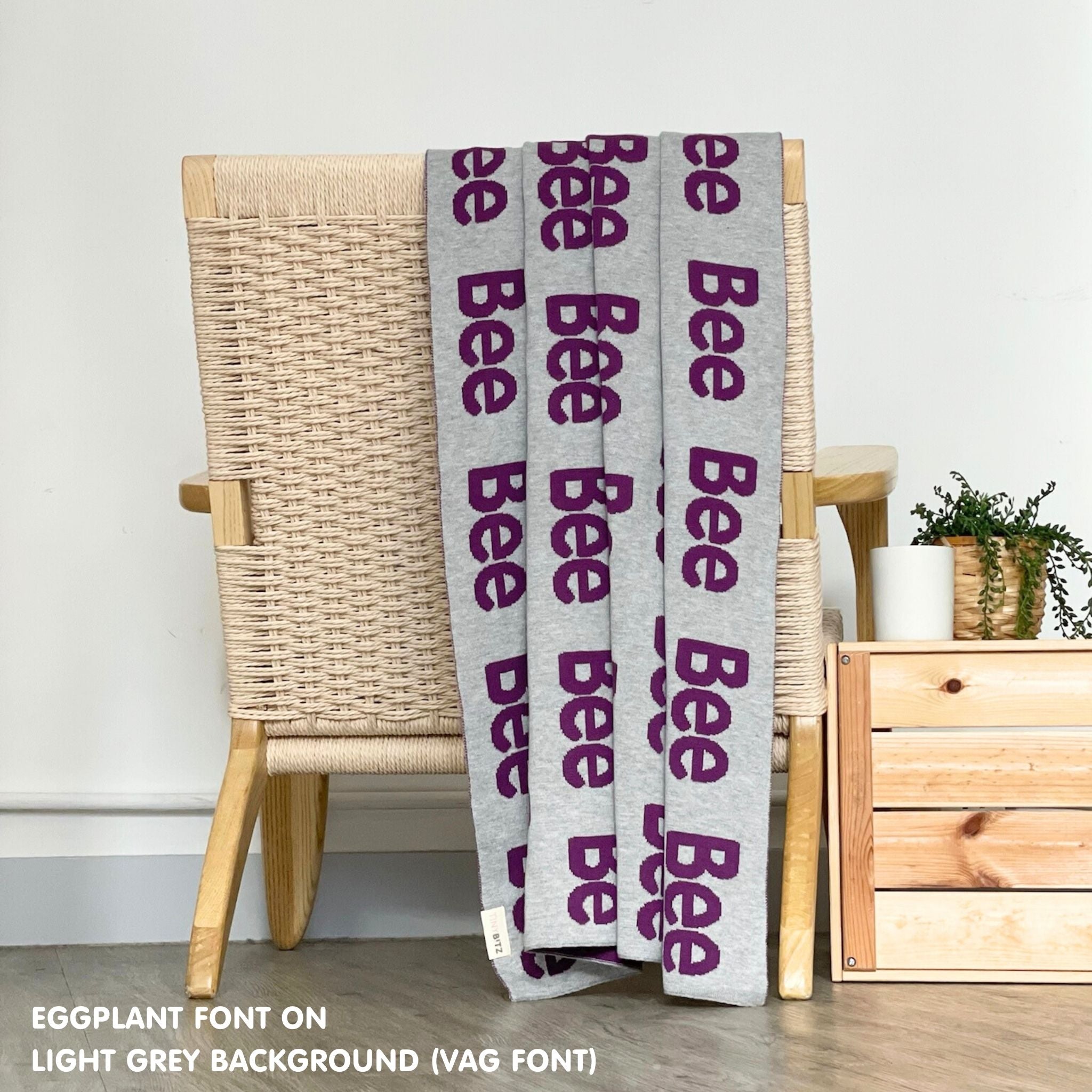 Custom cotton blanket for girls in light grey and eggplant, personalized by TinyBitz.