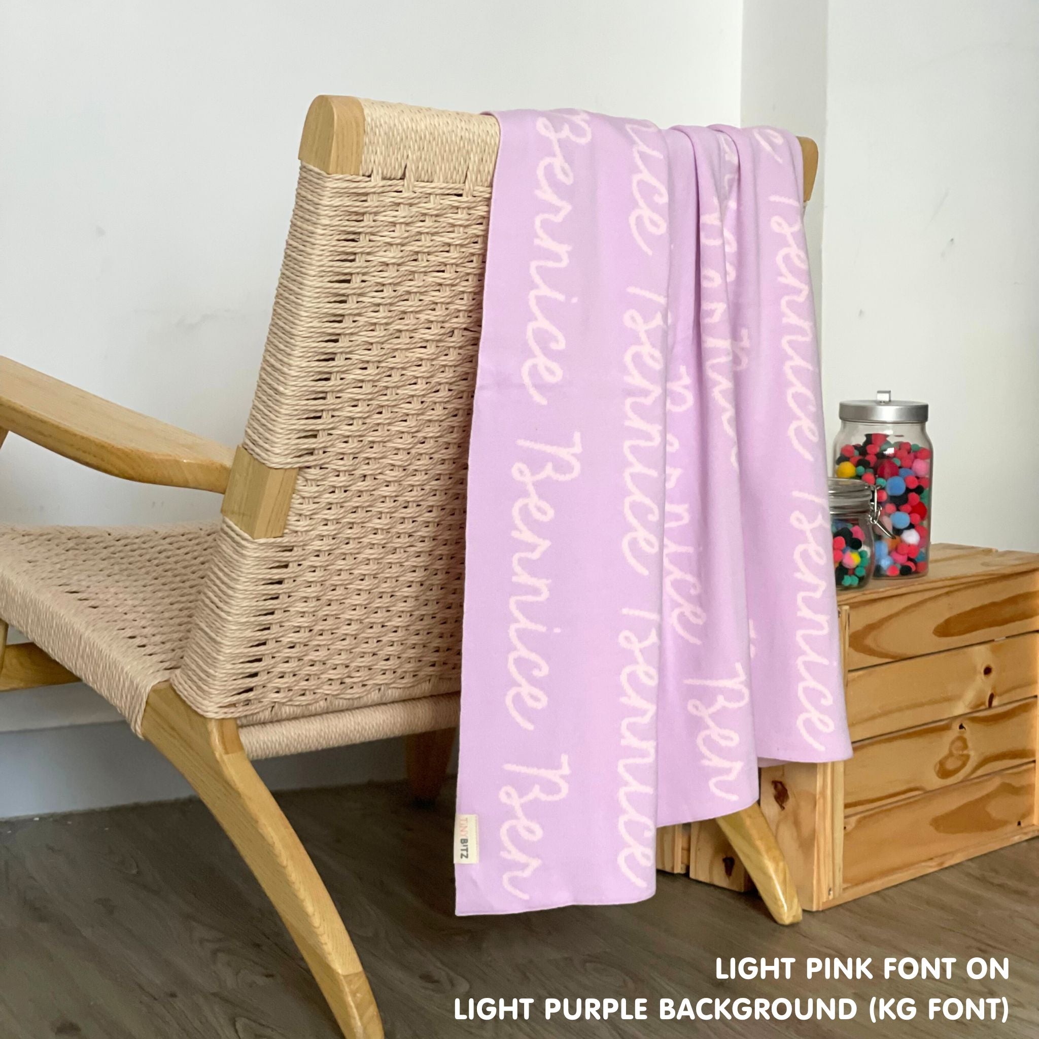 Cotton Kids Blanket with name knitted in light purple and light pink, made by TinyBitz.