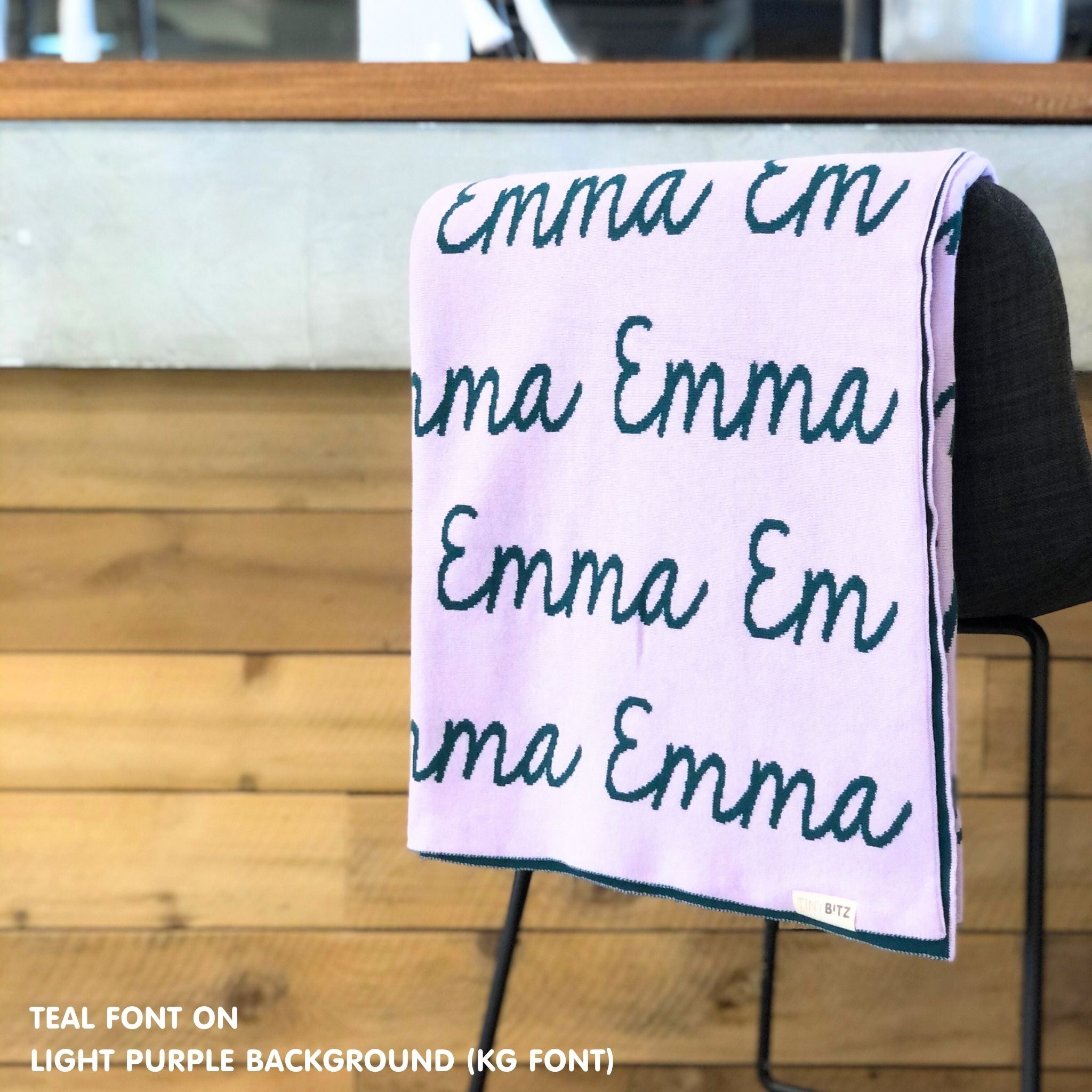 TinyBitz knitted cotton blanket in light purple and teal, personalized with your kid’s name.