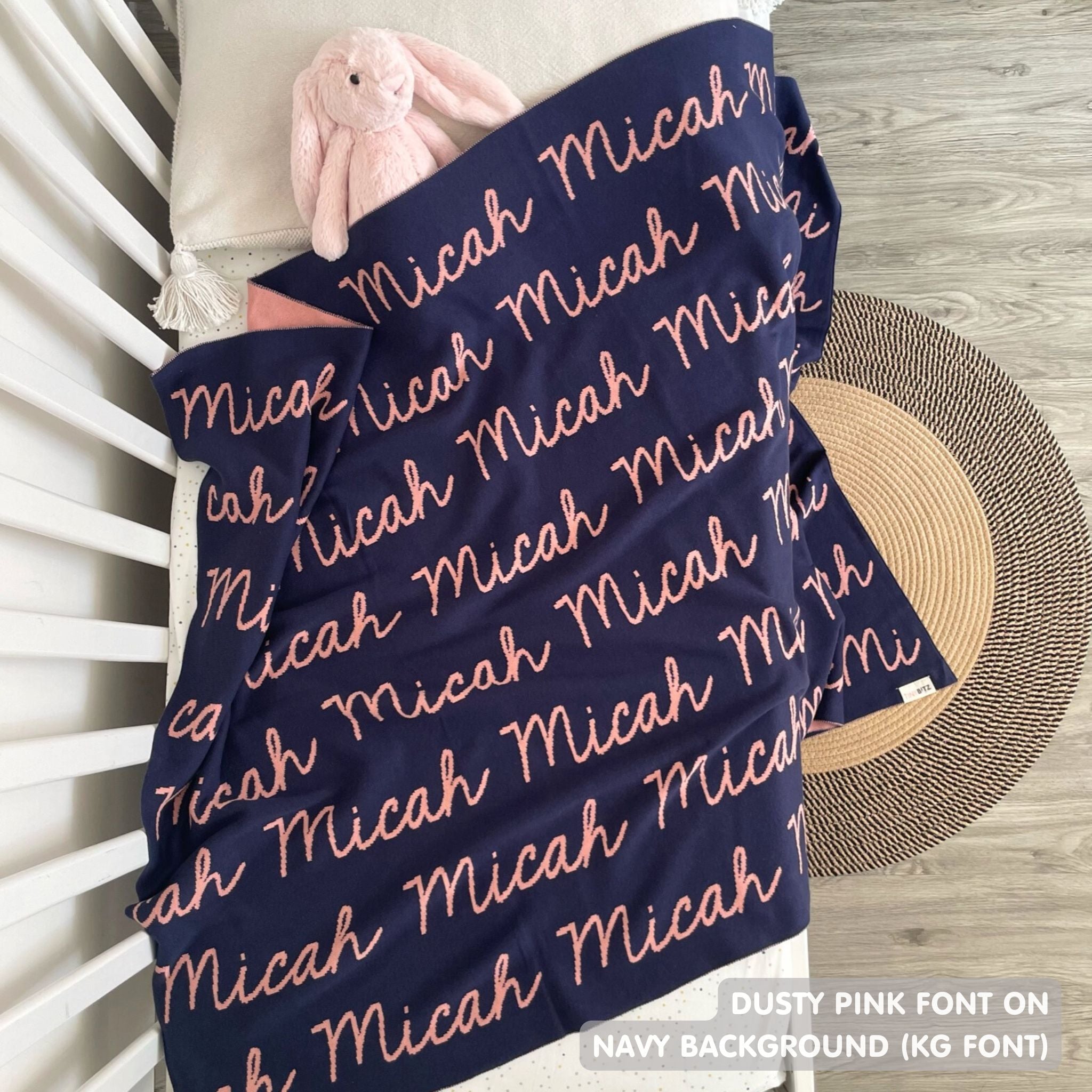 Knitted Children blanket in navy and dusty pink, customised with kid's name, made by TinyBitz.