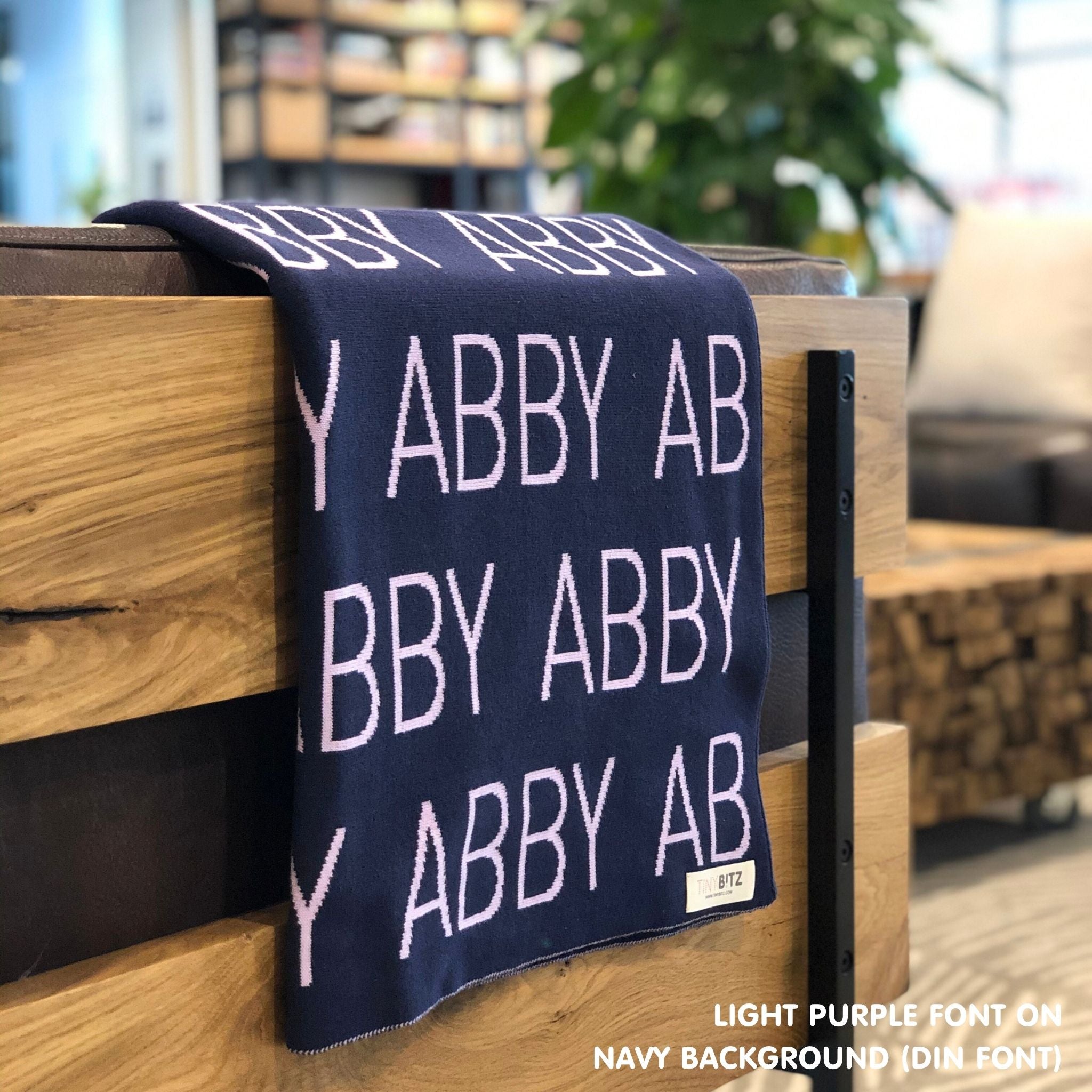 Custom cotton blanket for girls in navy and light purple, personalized by TinyBitz.
