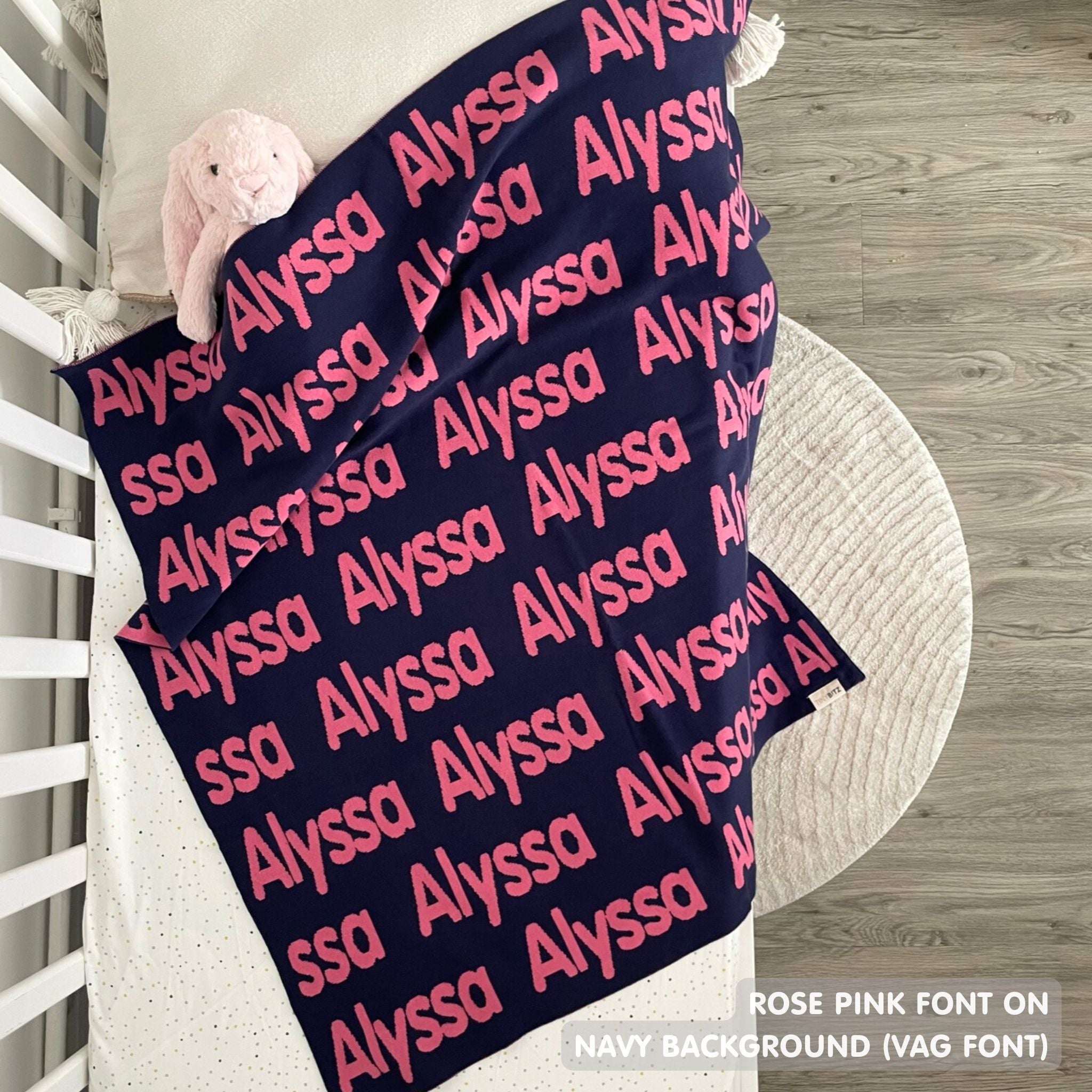 Knitted Children blanket in navy and rose pink, customised with kid's name, made by TinyBitz.