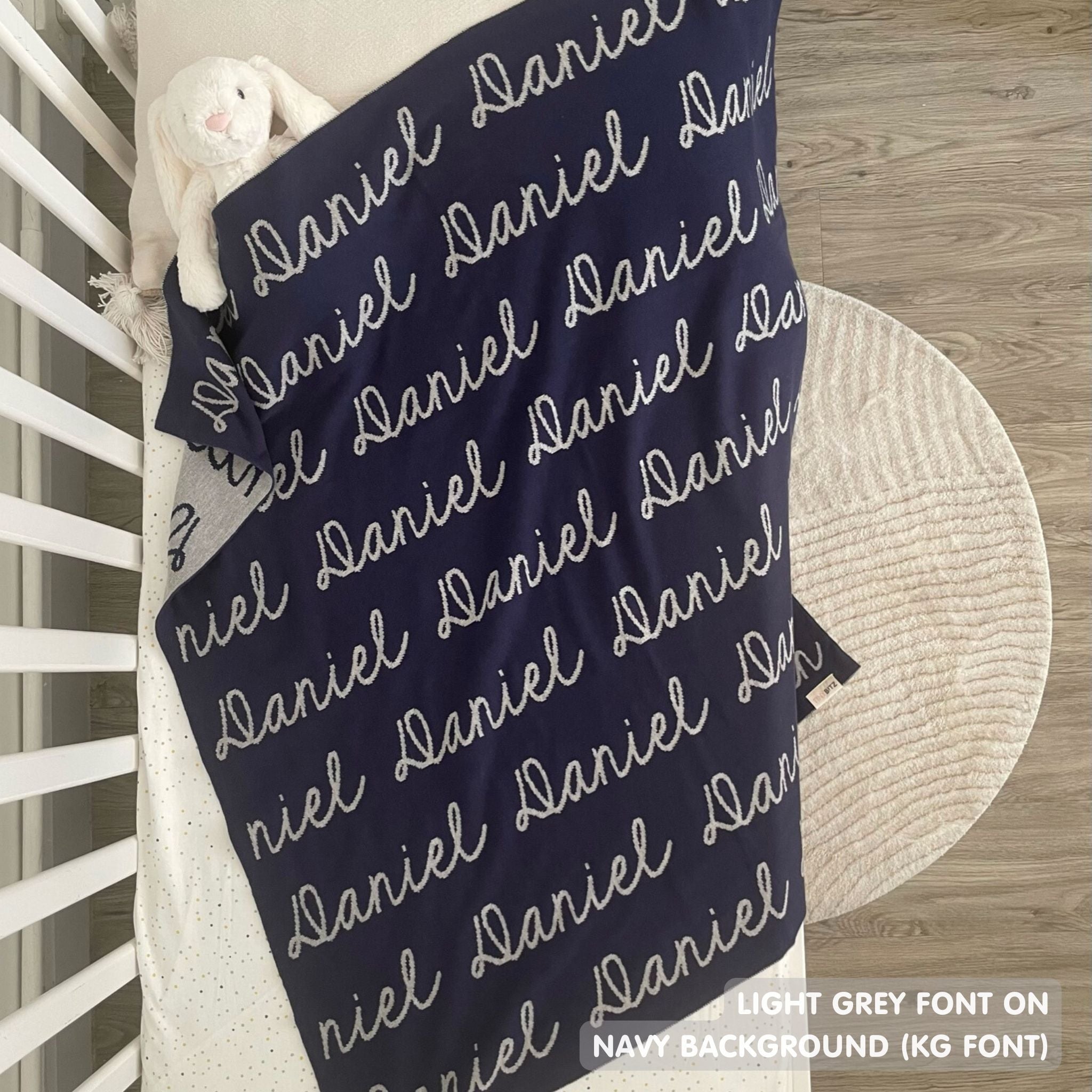 Cotton Kids Blanket with name knitted in navy and light grey, made by TinyBitz.