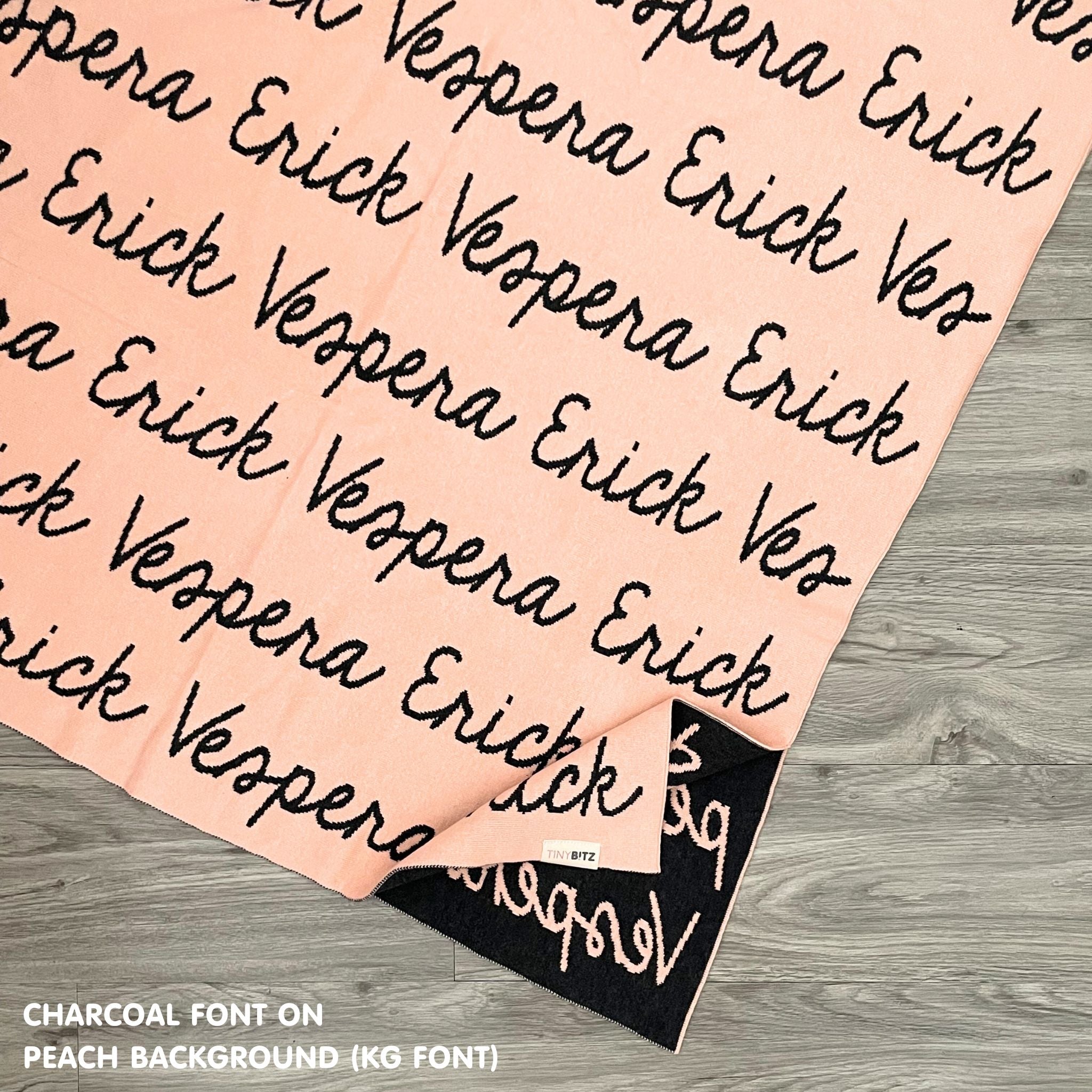 Knitted Children blanket in peach and charcoal, customised with kid's name, made by TinyBitz.