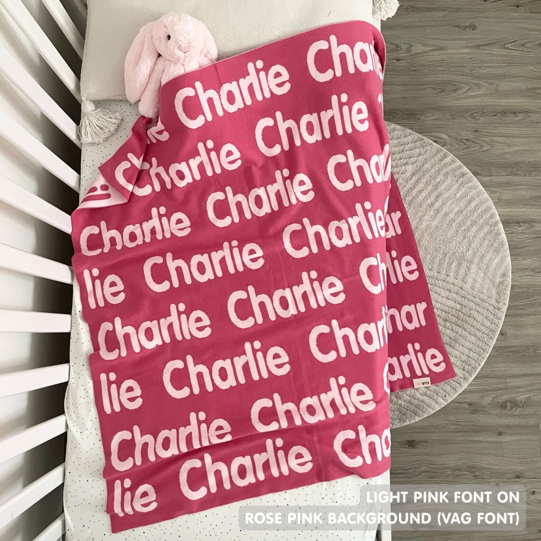 Custom cotton blanket for girls in rose pink and light pink, personalized by TinyBitz.