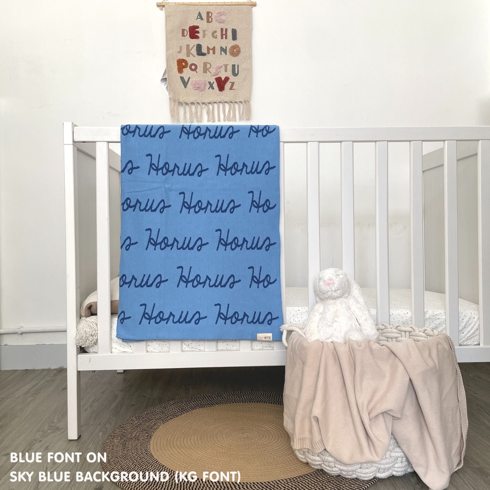 TinyBitz Kids Blanket in sky blue and blue, personalized with child's name and made from 100% cotton.