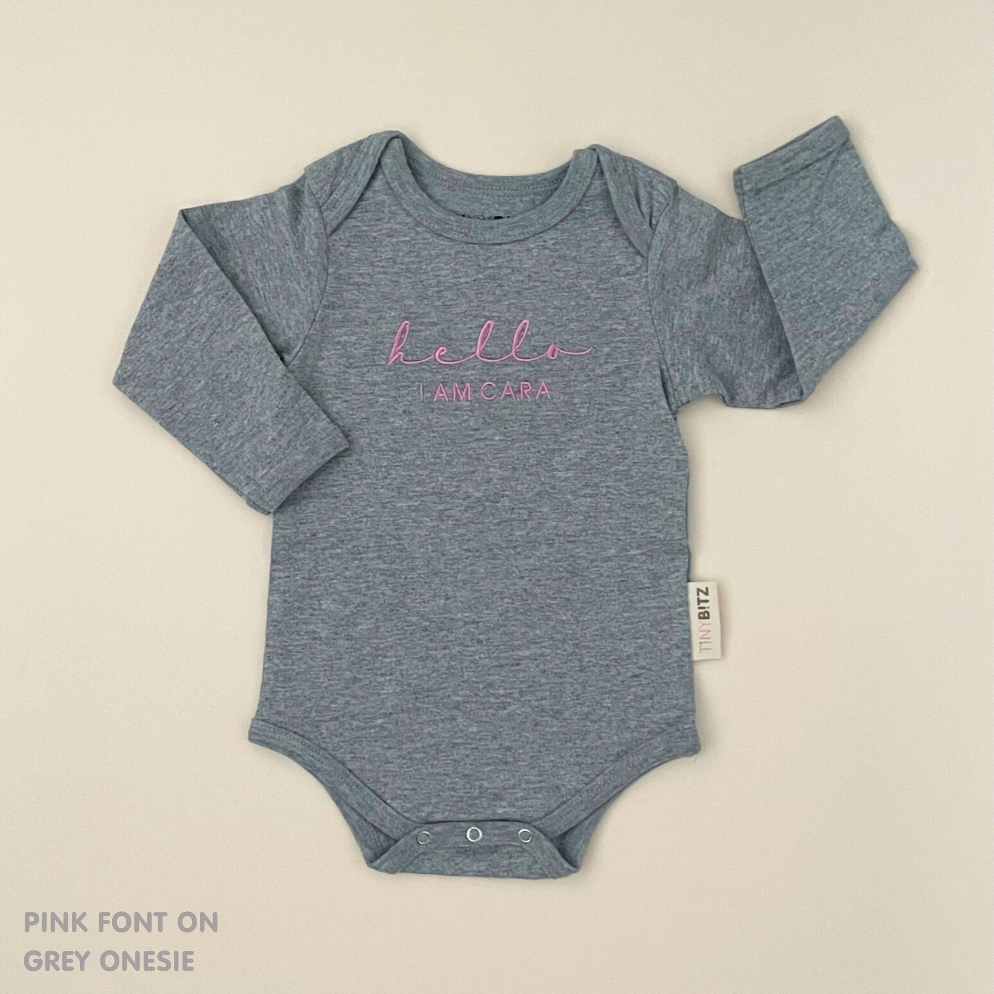 Custom name onesie in grey, personalised baby clothing made with soft breathable fabric by TinyBitz.