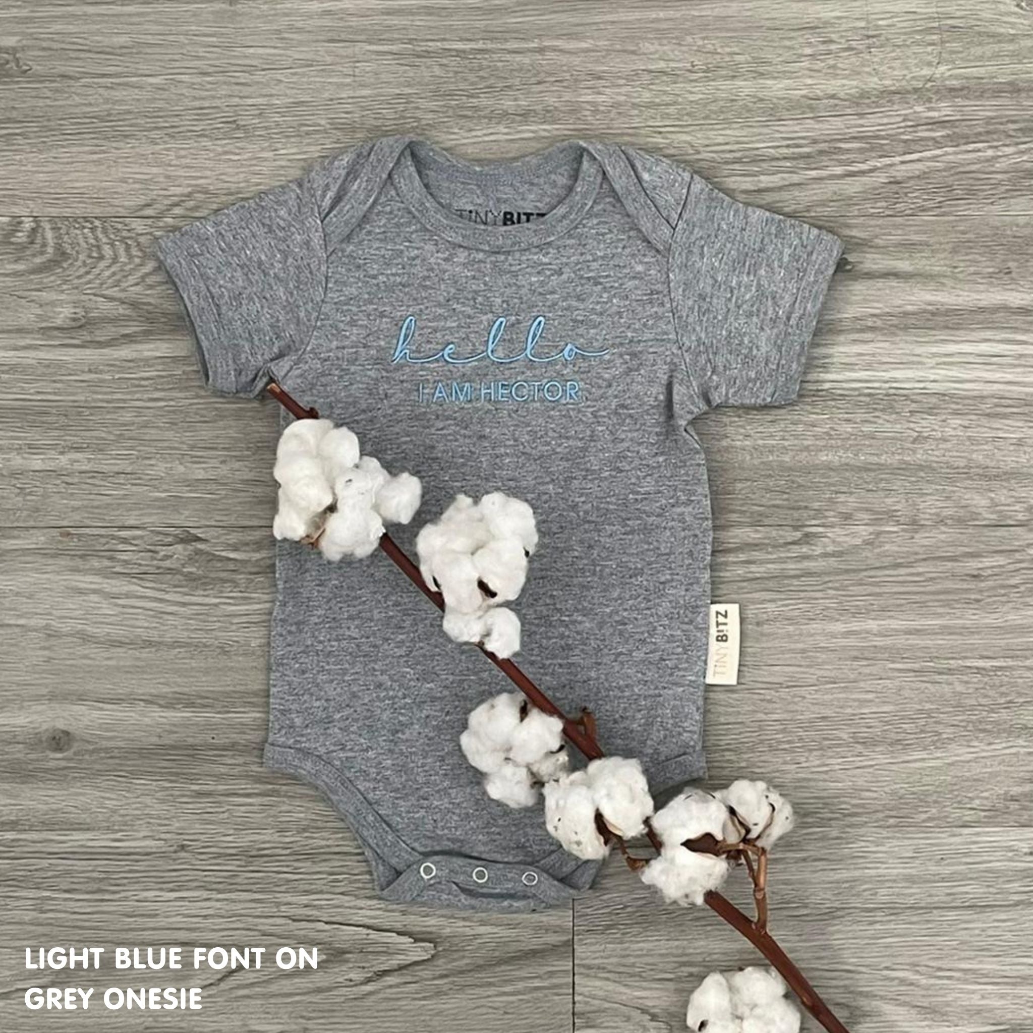 Organic cotton grey onesie for babies with embroidered name, personalized baby shower gift keepsake from TinyBitz.