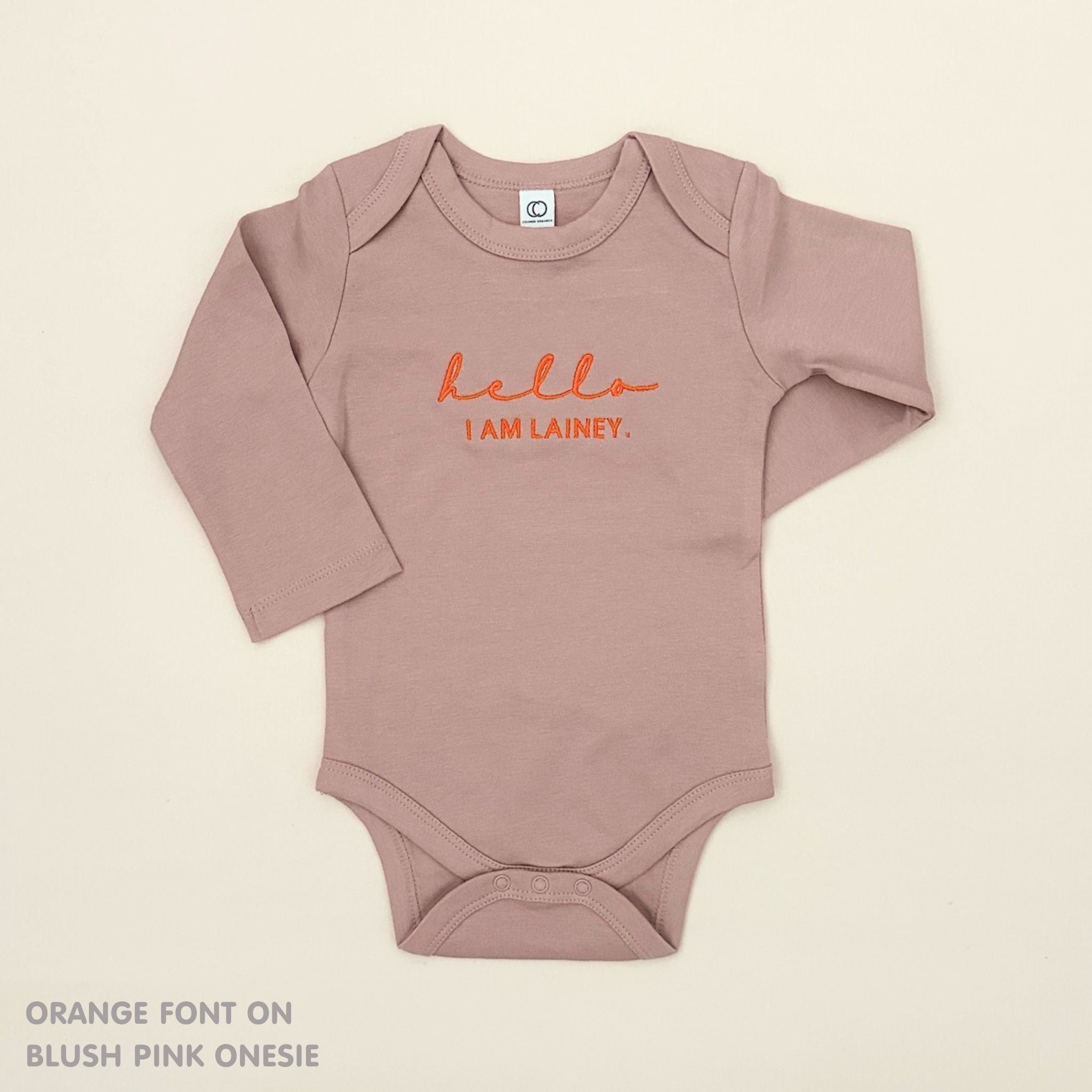 Organic cotton baby onesie with custom name, ideal for birth announcements, baby shower gifts, and keepsakes by TinyBitz.