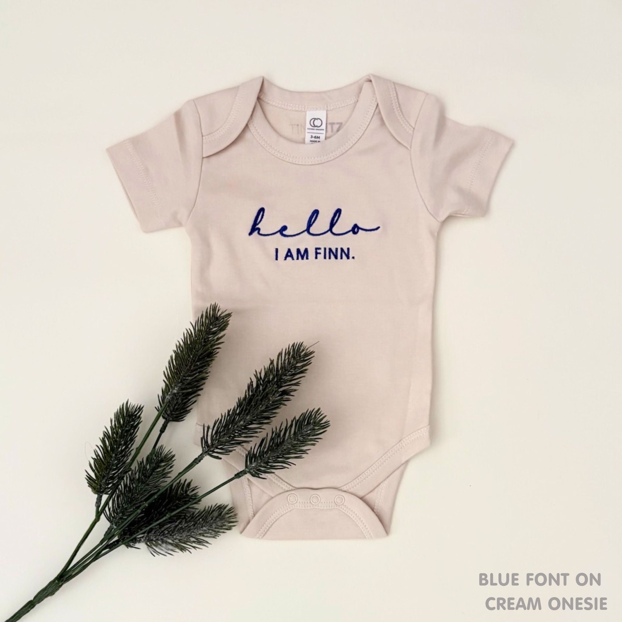 Personalised baby onesie with name embroidery in soft cream cotton, custom newborn gift by TinyBitz