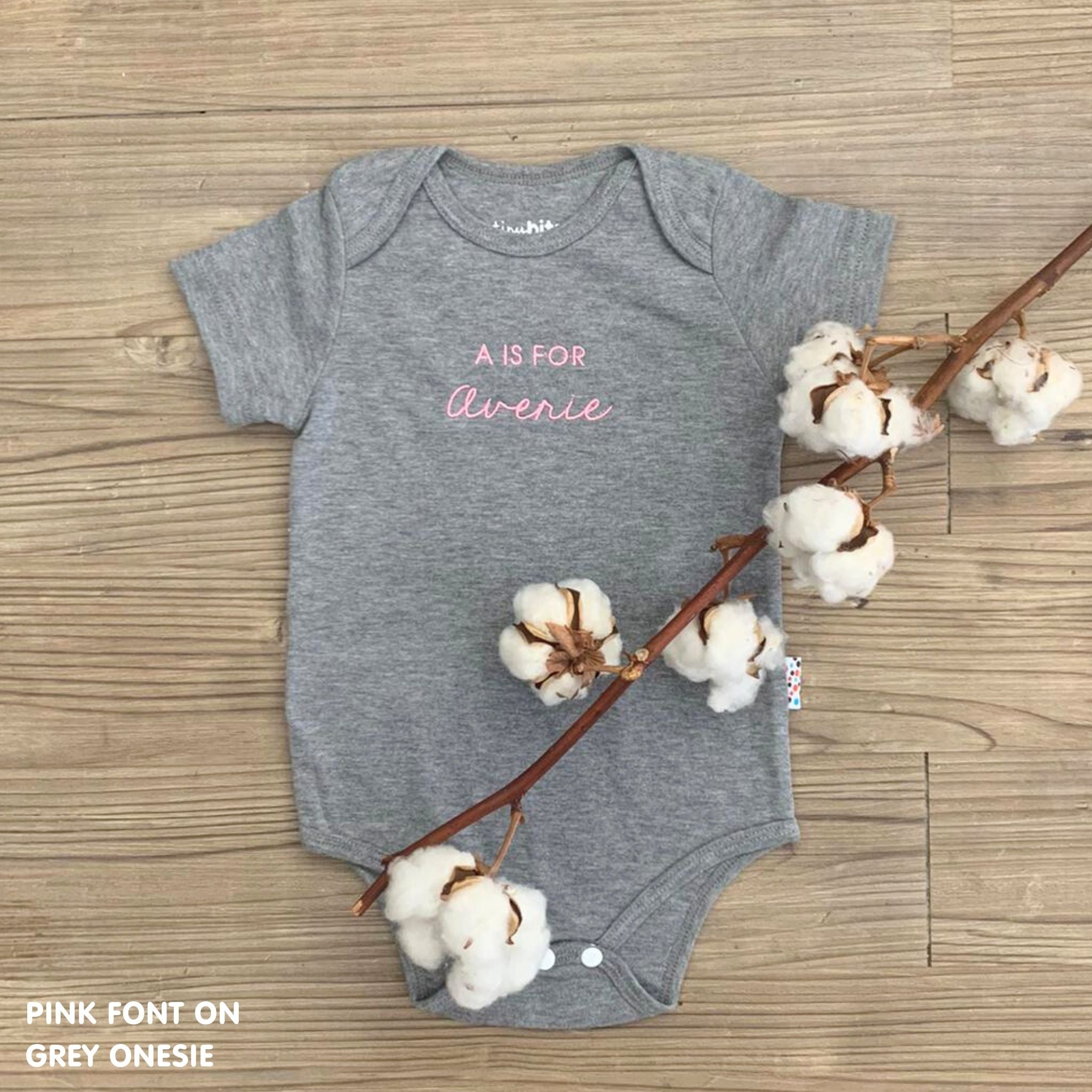 Custom name onesie in grey, personalised baby clothing made with soft breathable fabric by TinyBitz.