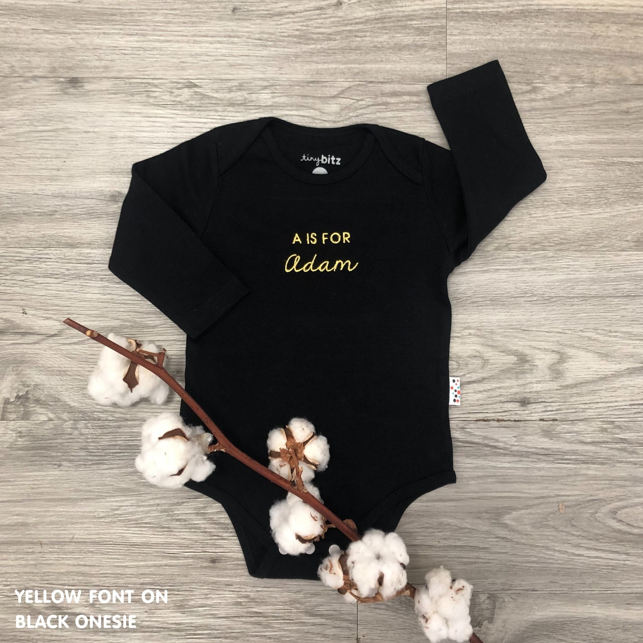 Personalised baby onesie with name embroidery in soft black cotton, custom newborn gift by TinyBitz