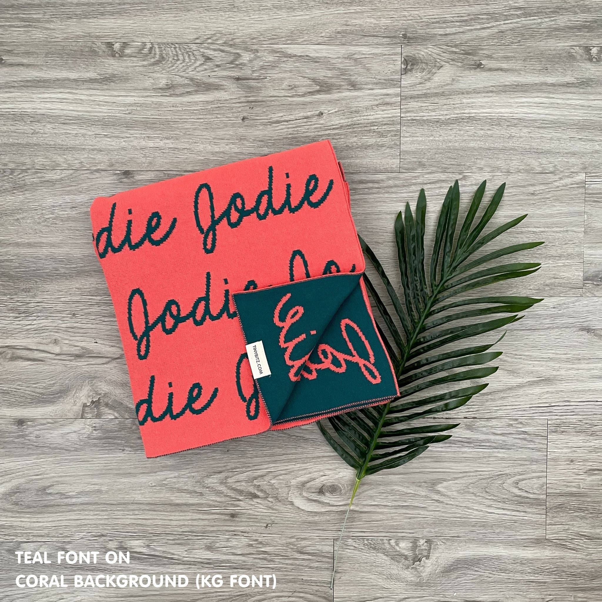 Personalised pet blanket in coral and teal knitted cotton, cozy custom dog blanket by TinyBitz, perfect personalized gift for pet lovers.