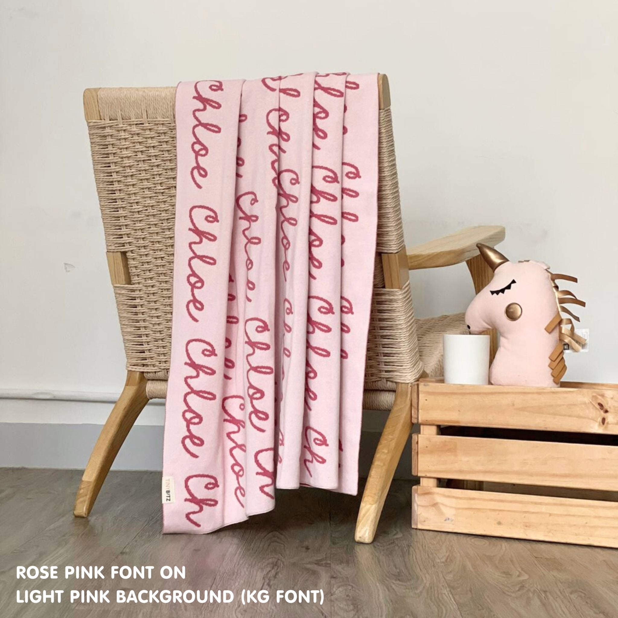 Personalised pet blanket in light pink and rose pink knitted cotton, custom knitted dog blanket by TinyBitz, perfect gift for dog lovers.