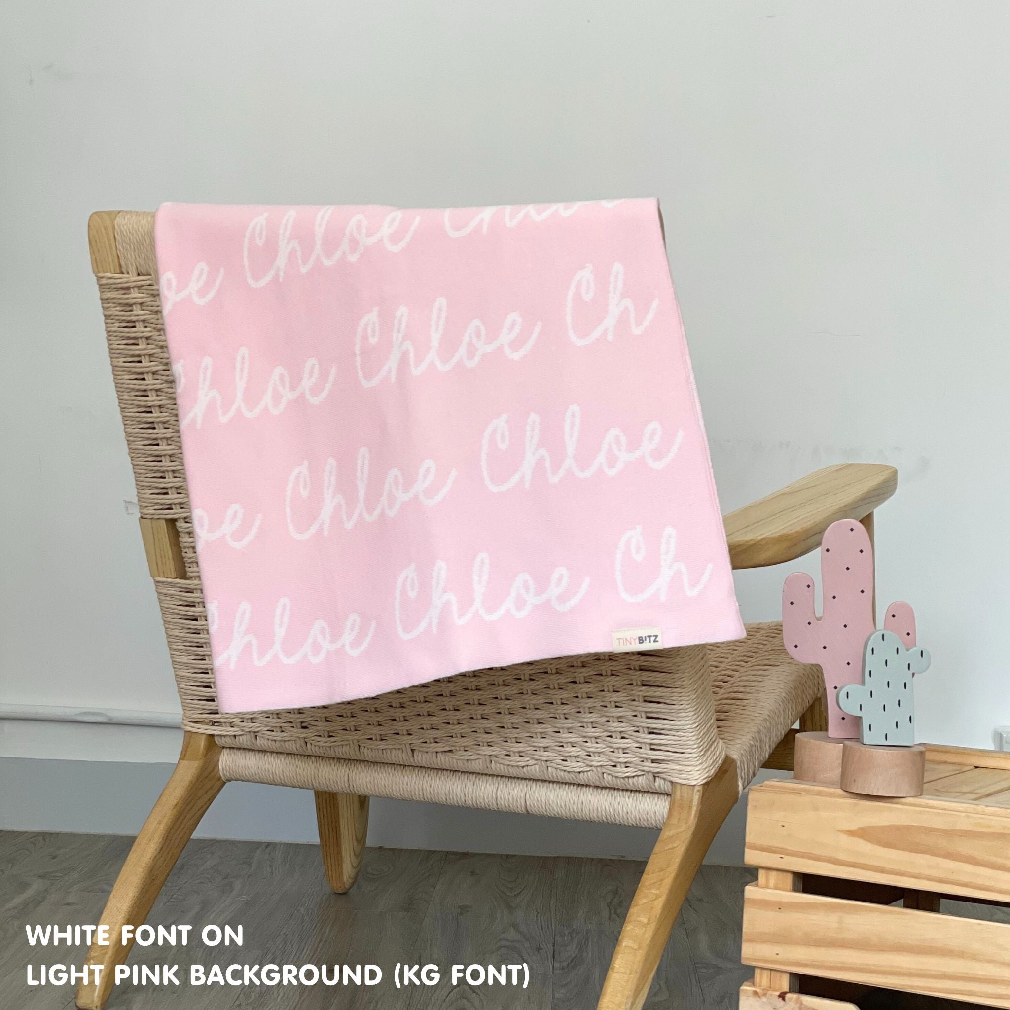 Personalised pet blanket in light pink and white knitted cotton, cozy custom cat blanket by TinyBitz, perfect personalized gift for pet lovers.