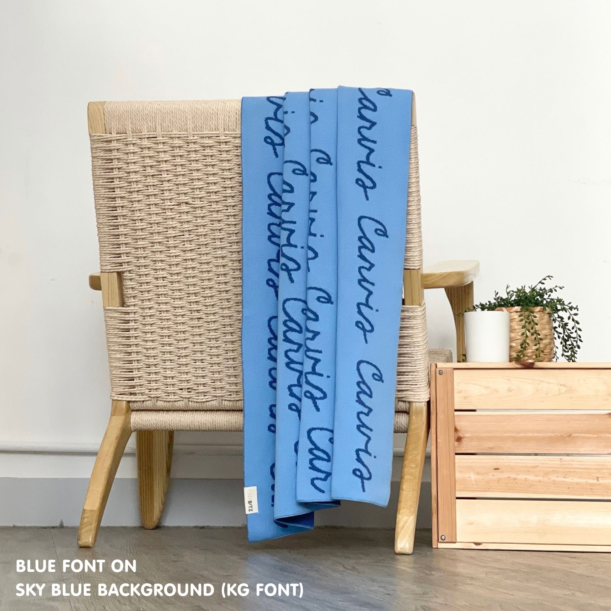 Personalised pet blanket in sky blue and blue knitted cotton, custom knitted dog blanket by TinyBitz, perfect gift for dog lovers.