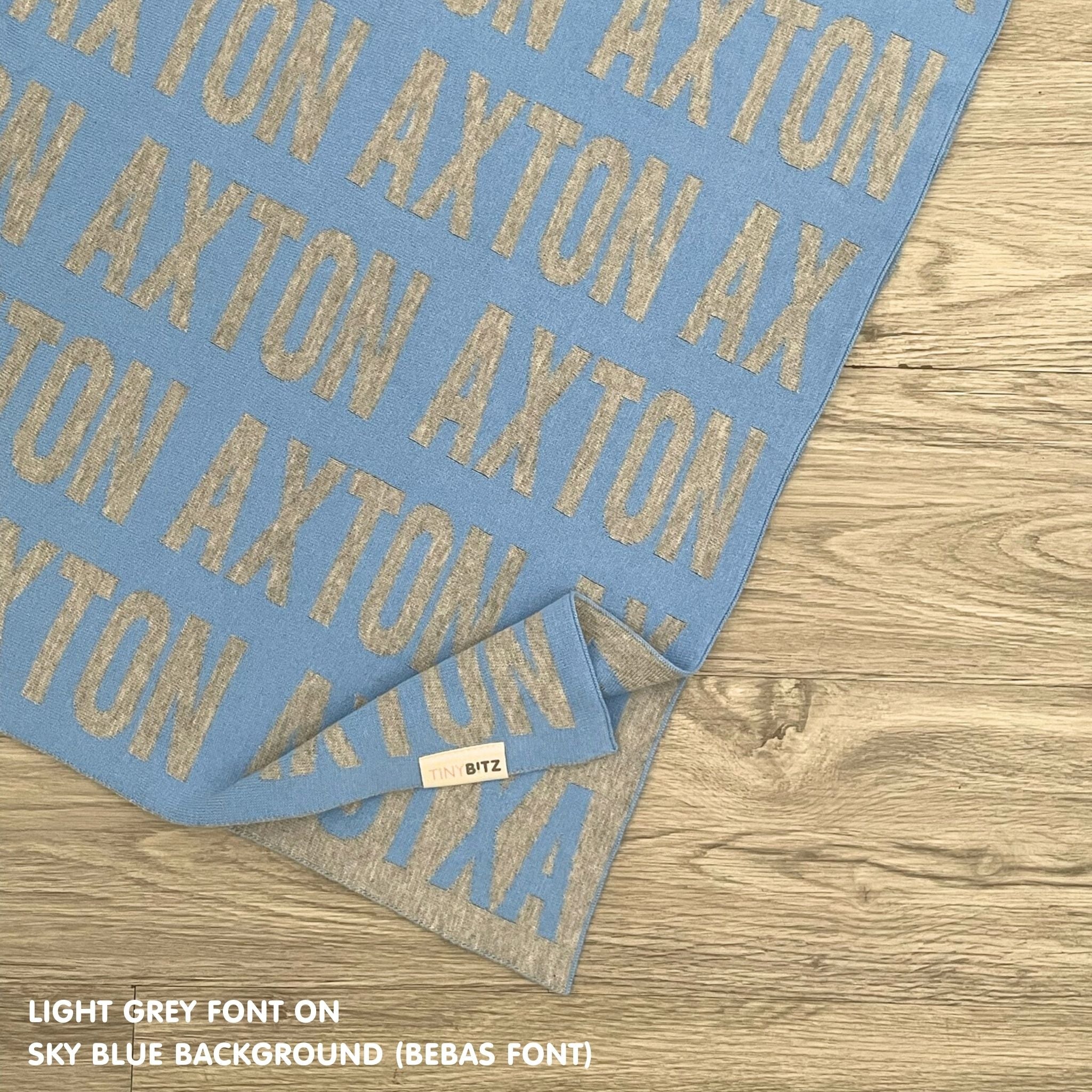 Personalised pet blanket for cats in sky blue and light grey knitted cotton, custom knitted cat blanket by TinyBitz, perfect gift for cat lovers.