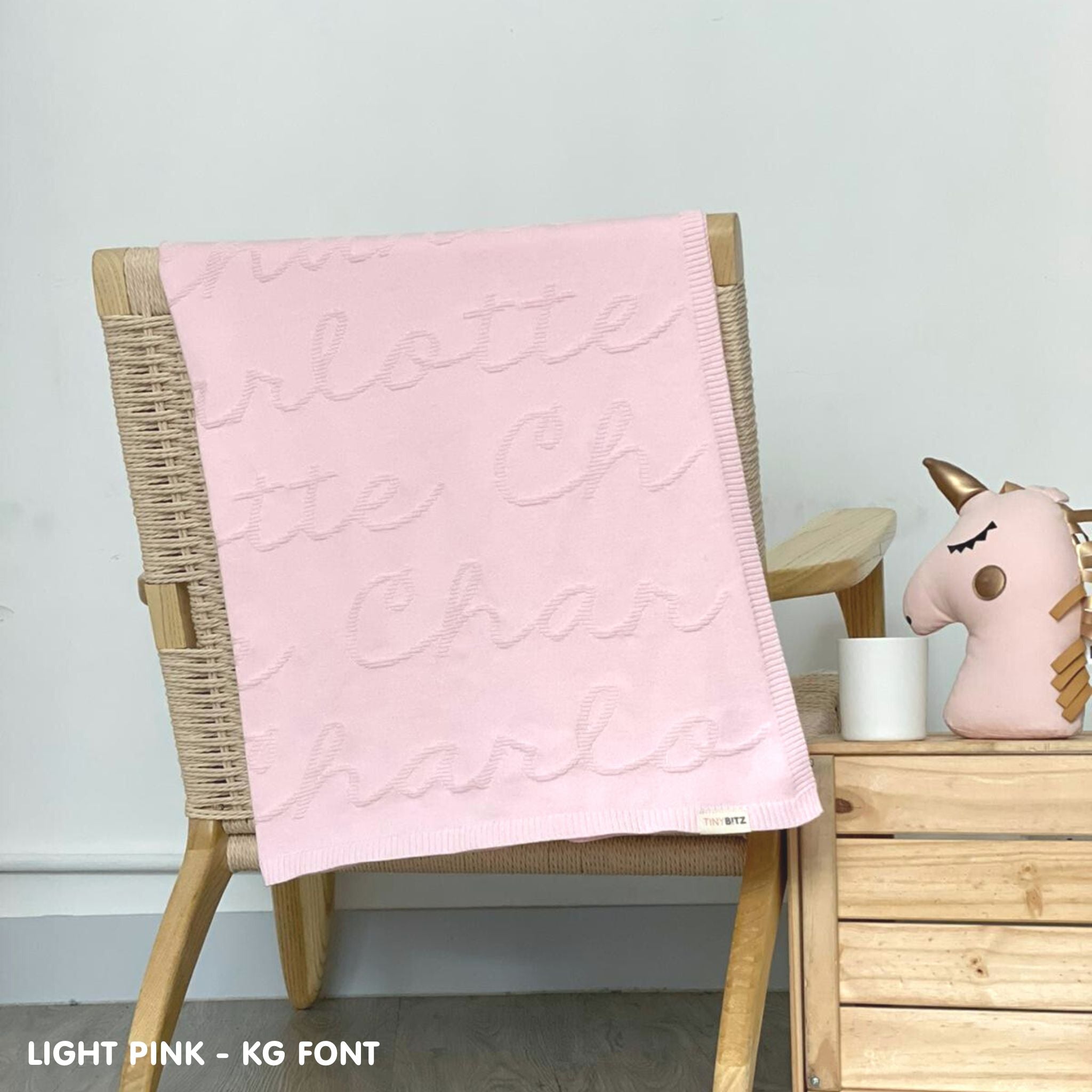 TinyBitz Custom Blanket with baby's name on light pink background, one colour with monogram, best gift to welcome a newborn baby.