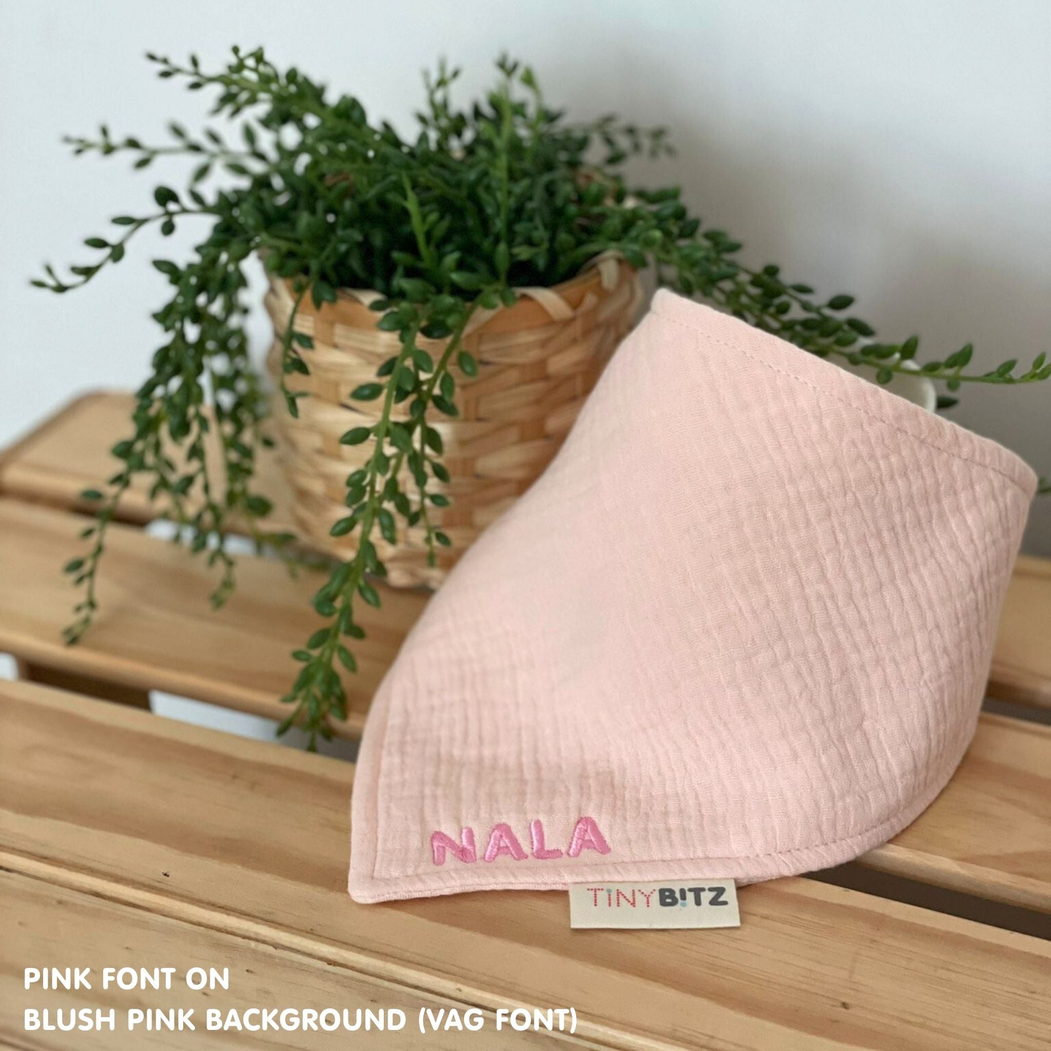 Personalised baby bib in blush pink with name embroidery, custom organic cotton bib by TinyBitz, thoughtful baby shower gift.