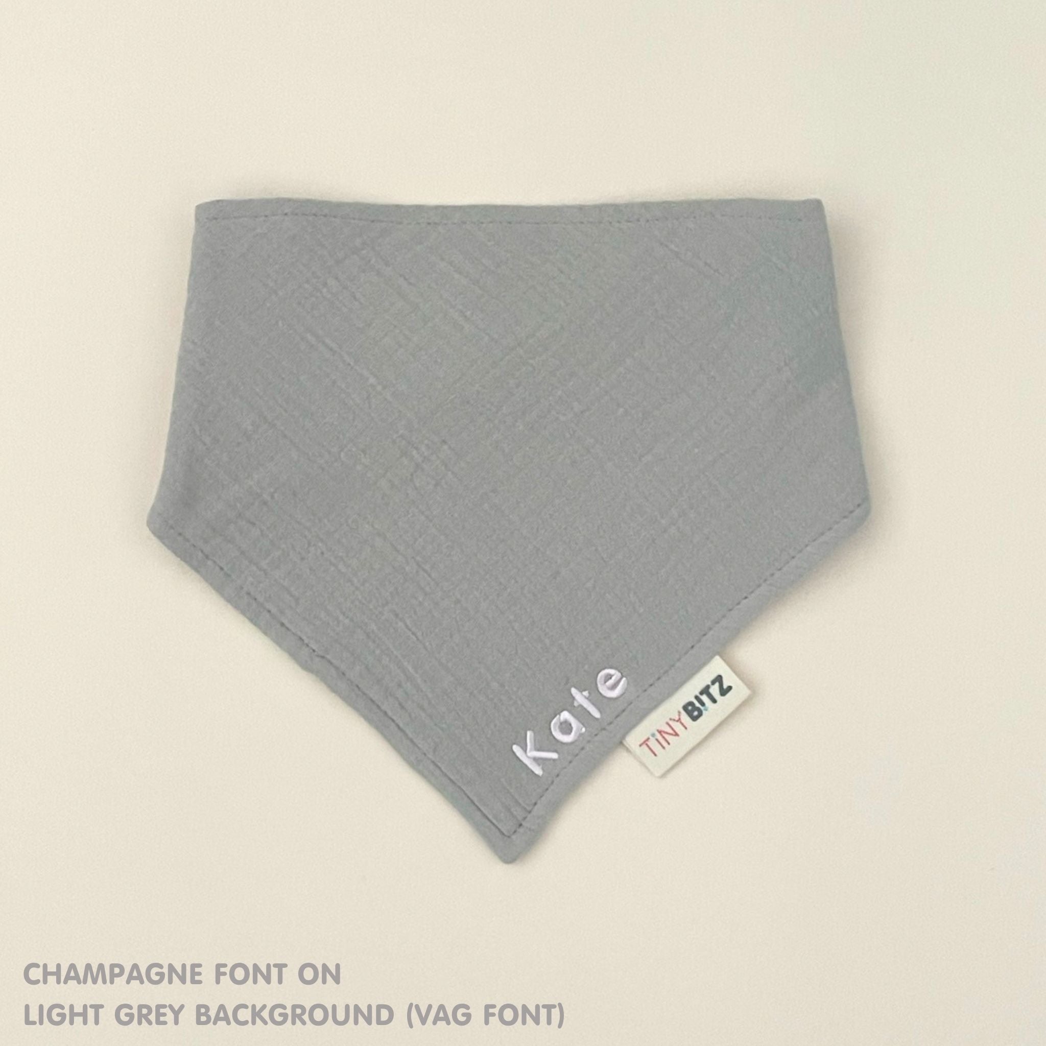 Personalised baby bib in light grey with name embroidery, custom organic cotton bib by TinyBitz, thoughtful baby shower gift.