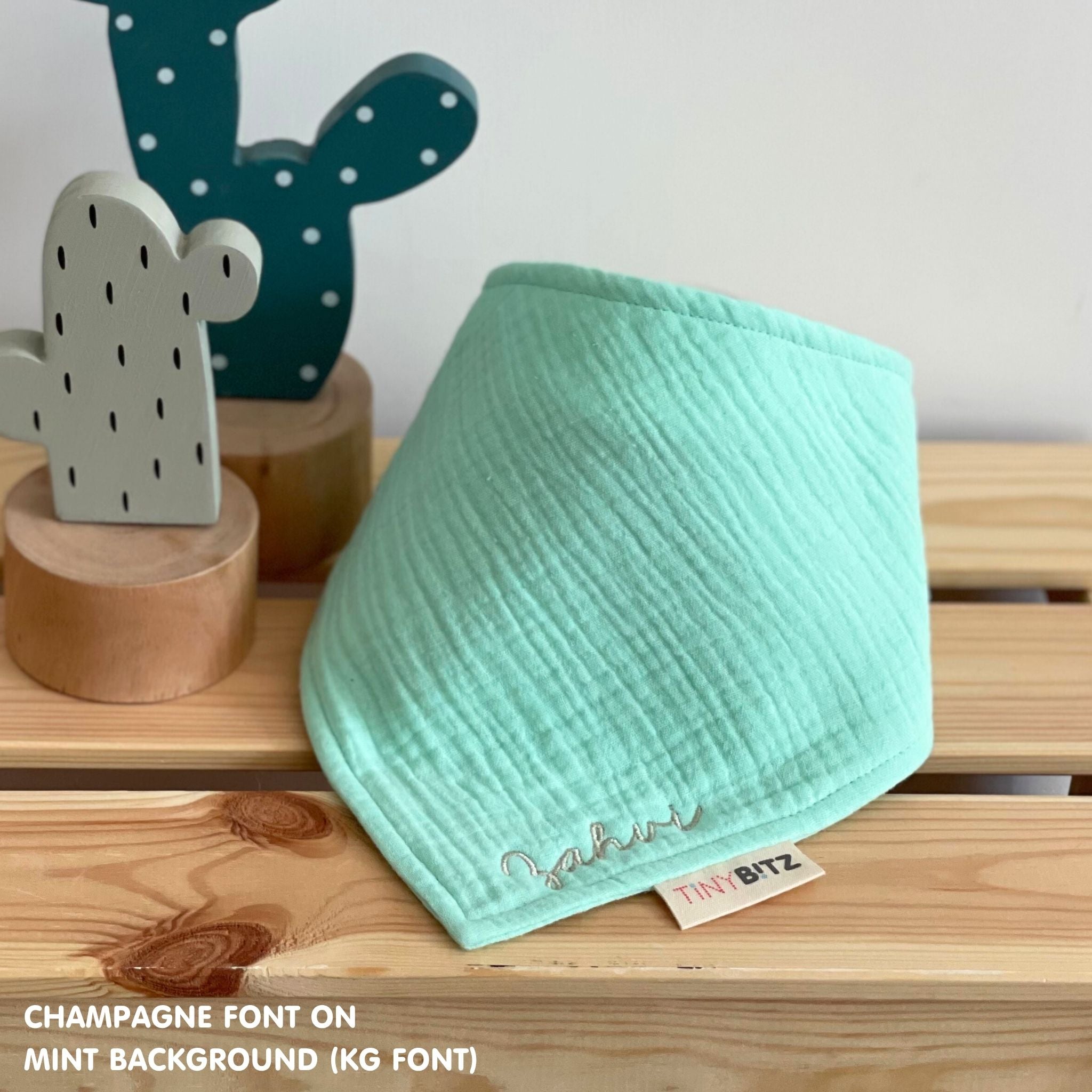 Organic personalised bib for babies in mint, featuring baby name in script font, unique baby gift idea by TinyBitz.