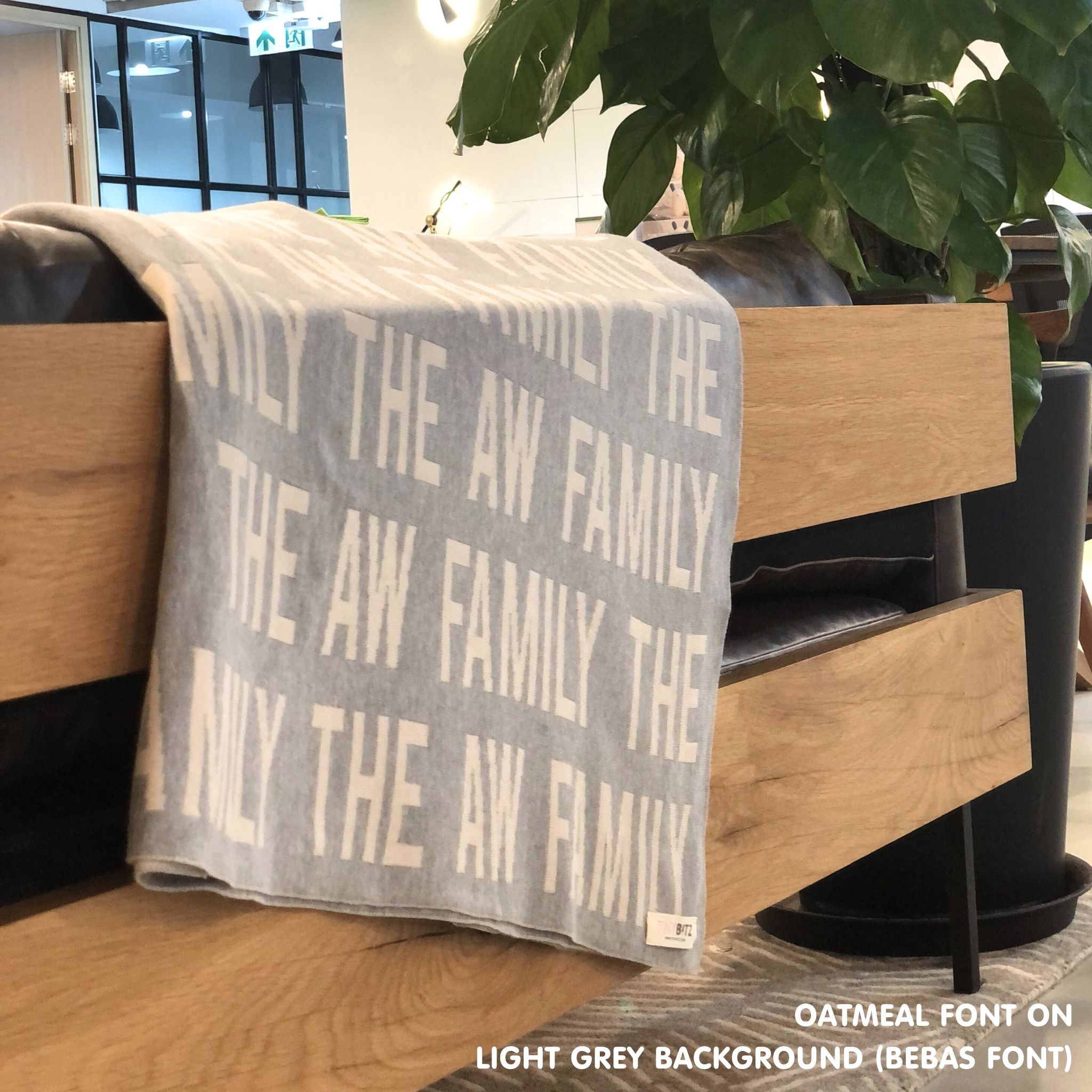 Custom knitted blanket with family members' names on it, making it the best personalised family gift!