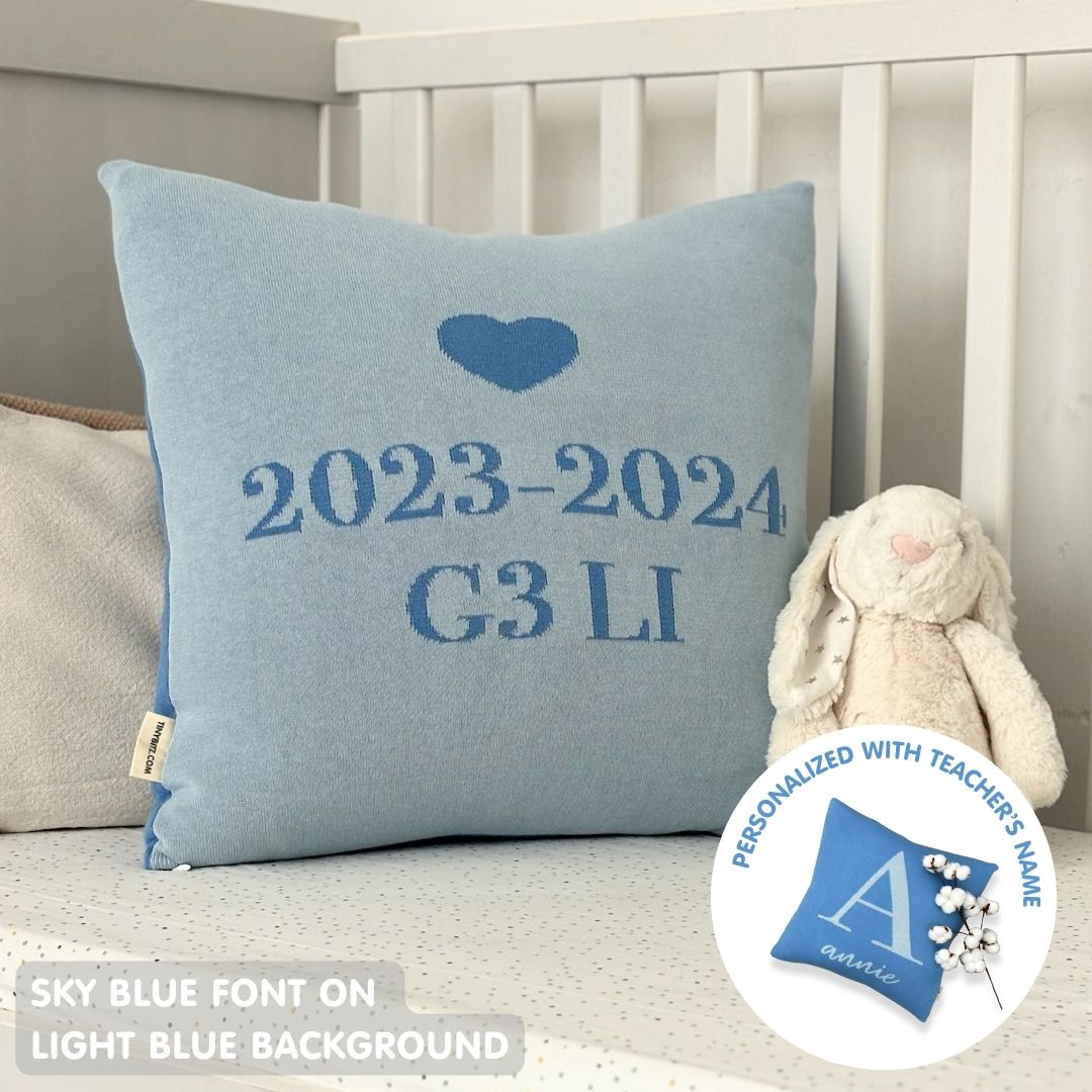Personalised cushion for teachers, featuring name Annie in light blue and sky blue knitted cotton, custom gift by TinyBitz.