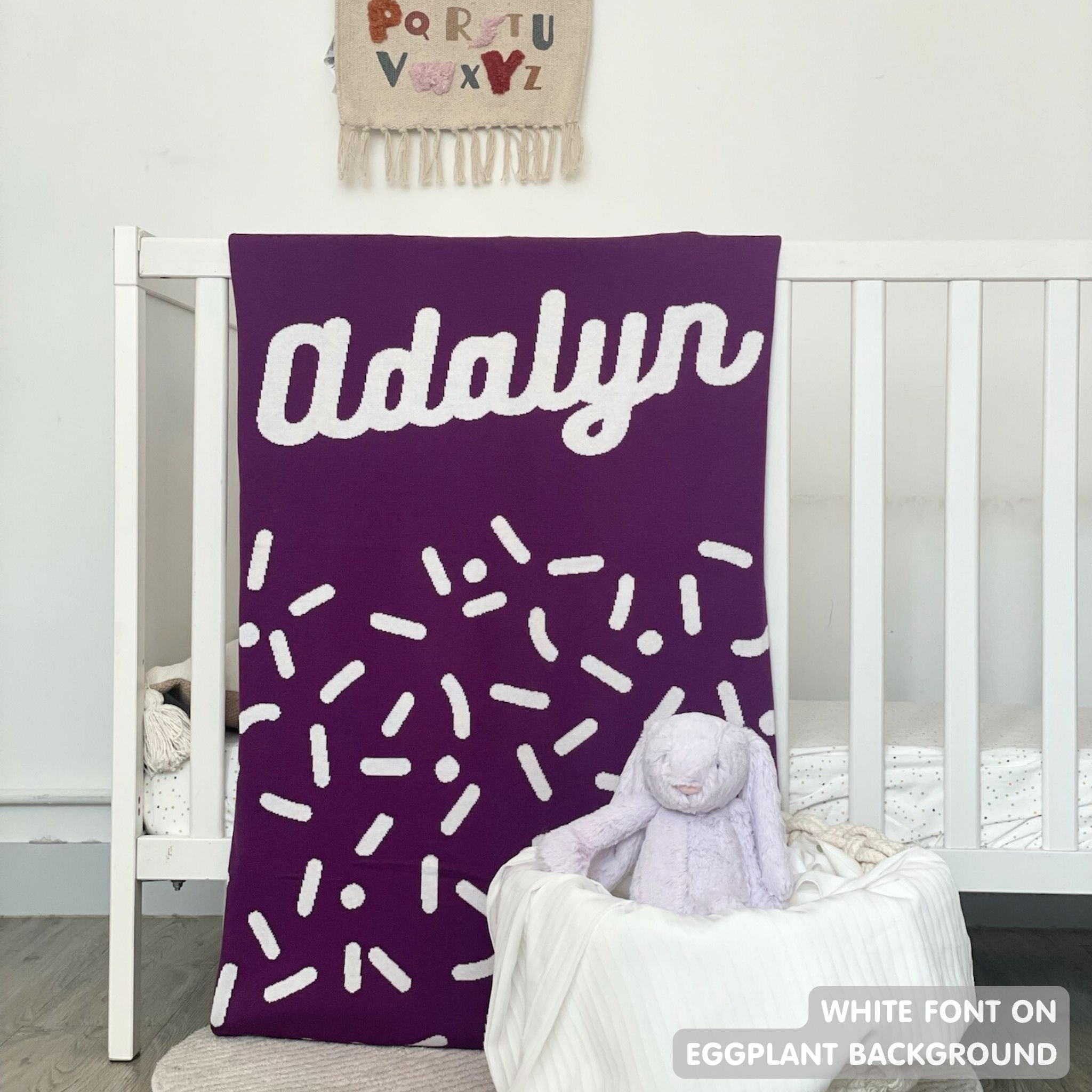 TinyBitz personalized name blanket in eggplant and white with a confetti pattern, perfect gift for newborn babies and kids.