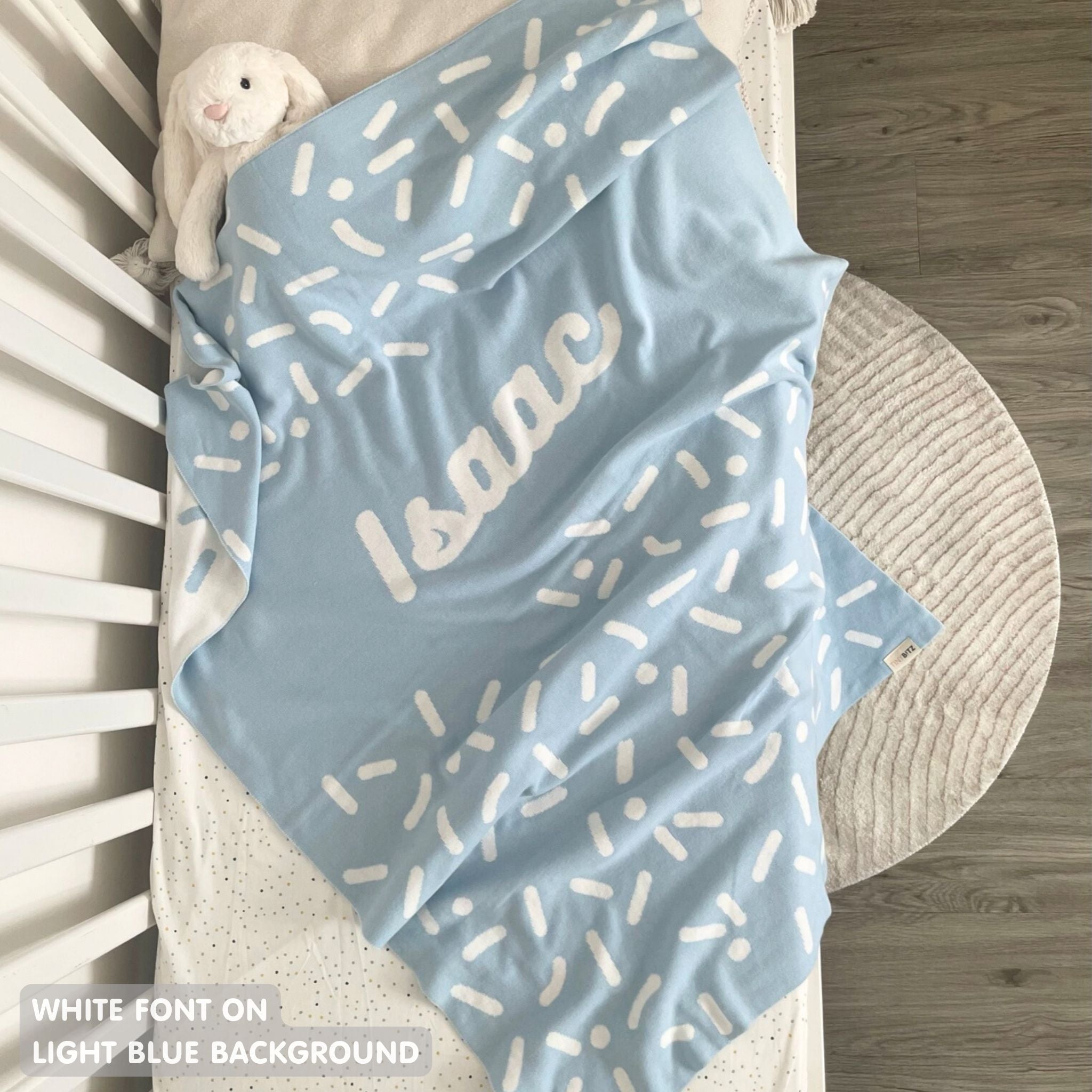 TinyBitz personalized baby knitted name blanket in light blue and white, perfect gift for birthdays and special occasions!