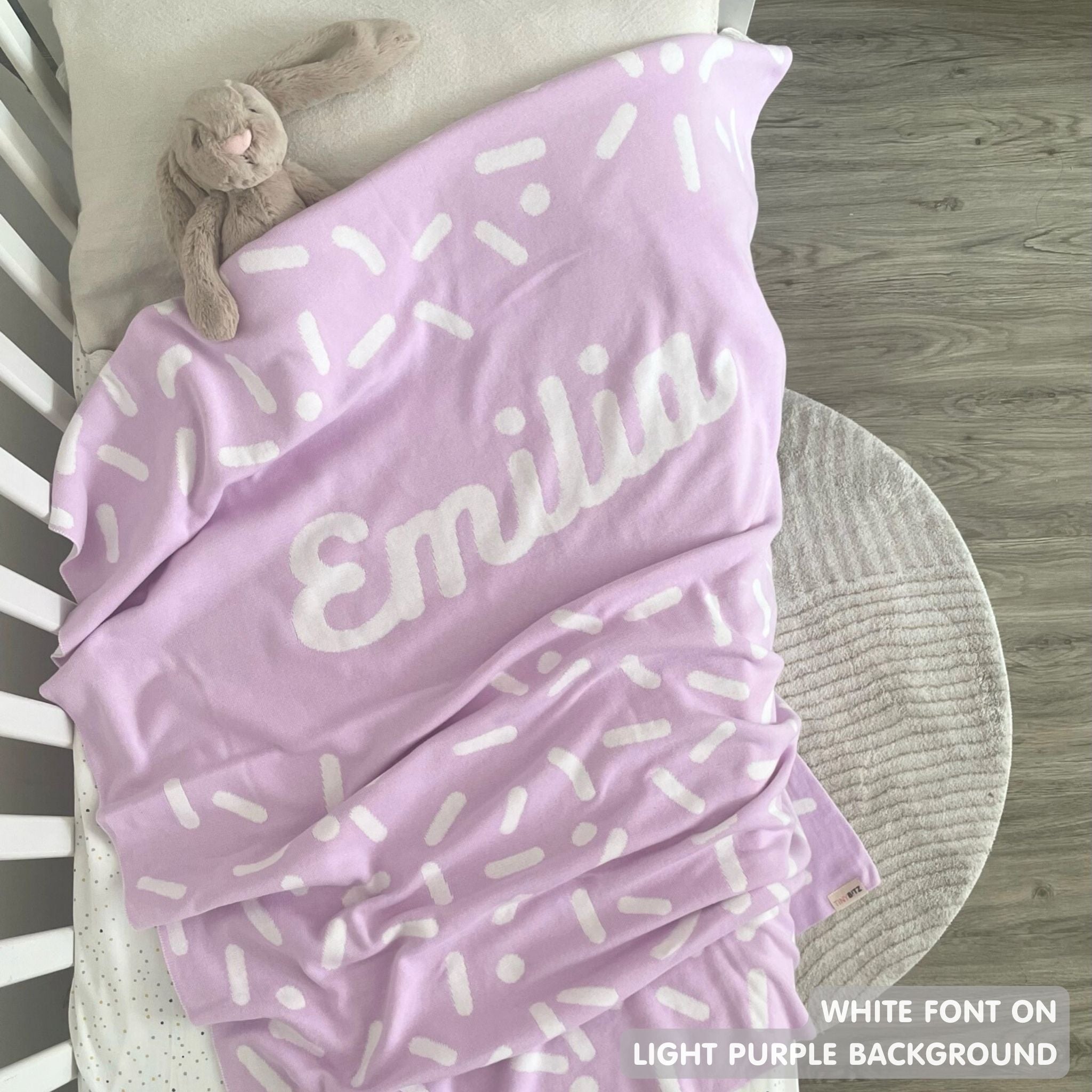 TinyBitz personalized name blanket in light purple and white with a confetti pattern, perfect gift for newborn babies and kids.