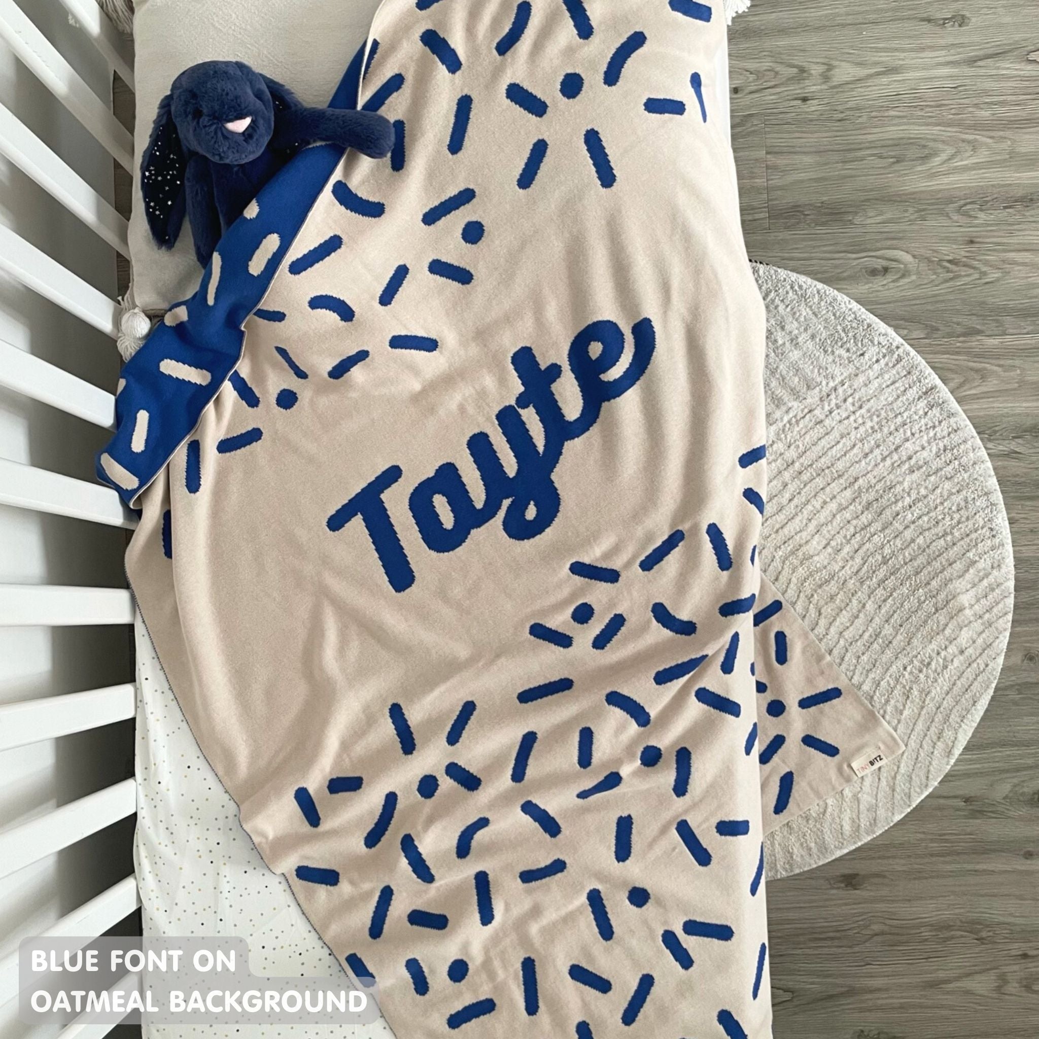 TinyBitz personalized baby name blanket, knitted in oatmeal and blue with a confetti pattern, perfect baby shower gift!
