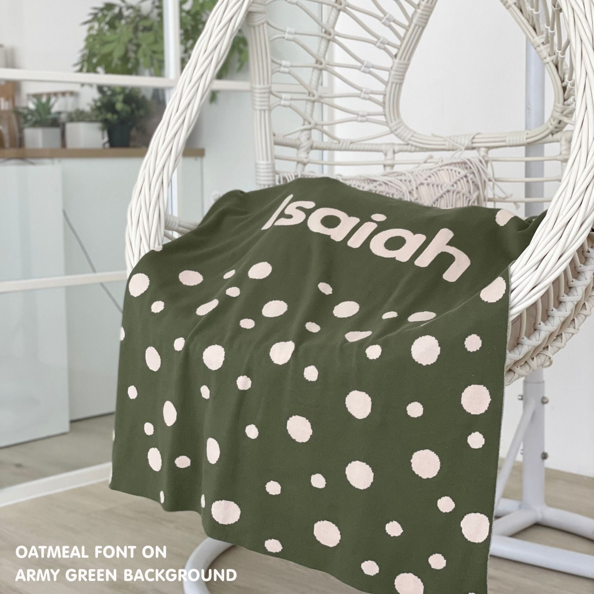 Cotton baby blanket with baby's name, knitted in army green and oatmeal with a dot pattern, made by TinyBitz.